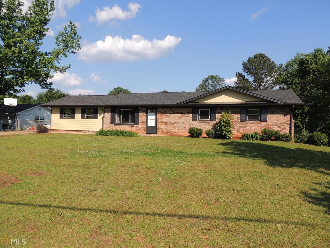 What a value in close in Douglas County! Updates throughout including a new roof/new maintenance free soffit & gutters/no leaf gutter guards/downspouts/hardiplank siding/Interior Paint/high efficient double pane vinyl windows/new light fixtures plus an updated kitchen with a new dishwasher plus a microwave! Whew-that's a lot! Fenced yard and a full basement with a workshop /storage area or room for future finishing*Boat door too*New laminate flooring*2 car side entry carport*No HOA*Great Rental of first time owner potential*Basement floors insulated*Super Sized Deck