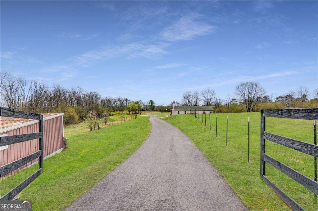 Discover the perfect opportunity to create your dream home on two beautiful acres of land with no HOA! This spacious and serene property offers the ideal setting for your vision - bring your own blueprints or choose from one of the stunning custom home options offered by our experienced builder. Enjoy the flexibility to design a home that perfectly suits your lifestyle, surrounded by the natural beauty that two acres provides. Whether you envision a modern farmhouse, a timeless traditional, or a contemporary retreat, the possibilities are endless. Located in an extremely desirable area with easy access to GA400, North Georgia Premium Outlet Mall, and all other needed attractions; this property combines peaceful living with everyday convenience. Don't miss the chance to create the home you've always dreamed of in a location you'll love! Highlights: -2+ Acres of gorgeous, buildable land -Bring your own blueprints OR choose from our custom home plans, to be built by our experienced builder -Private, serene setting with room to create your ideal layout -Endless possibilities to design a home that's uniquely yours -No HOA - Photos of Homes listed are the builders previous builds which are possible options.