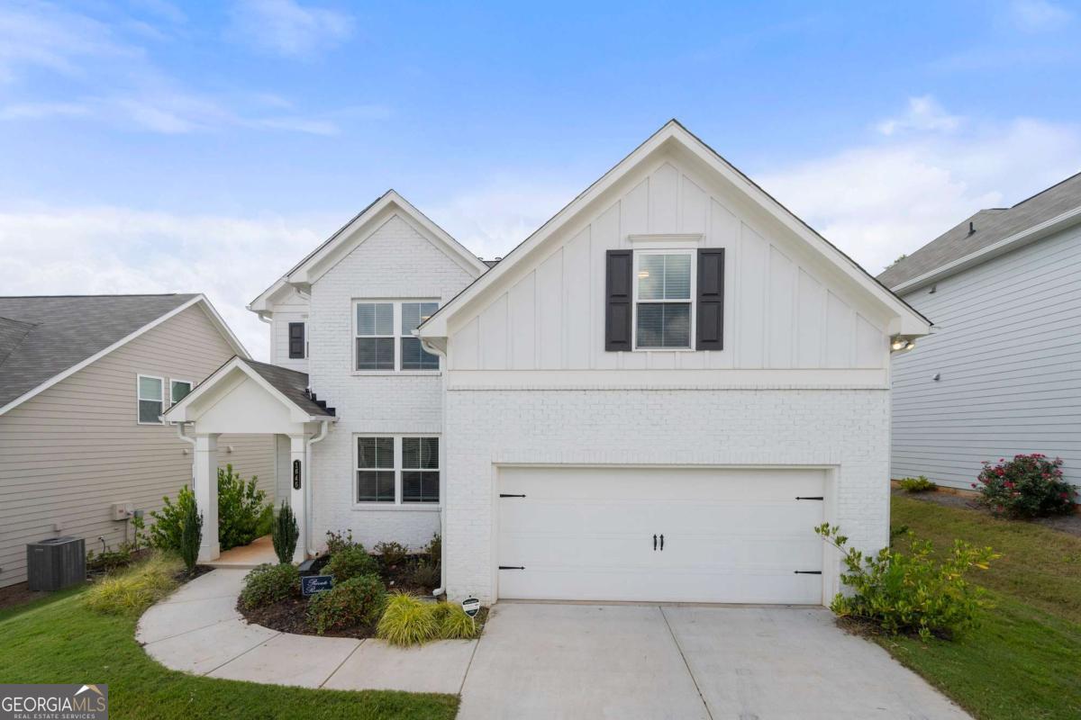 Welcome to your dream home in the heart of Mableton! This spacious 4-bedroom, 2.5-bath home beautifully combines comfort, style, and thoughtful upgrades-over $50,000 in premium enhancements installed by the seller. From the moment you enter, you're welcomed by a versatile flex space-perfect for a home office, formal dining room, or creative retreat. The open-concept design flows effortlessly into a cozy fireside living room and a chef's kitchen boasting an oversized island, upgraded vent hood, abundant counter space, and cabinetry designed for both everyday living and effortless entertaining. Upstairs, the primary suite offers a true retreat with a spa-like bath featuring a walk-in shower, soaking tub, and expansive closet space. Step outside and enjoy the covered patio overlooking a fully irrigated front and backyard-an ideal setting for outdoor dining, entertaining, or simply relaxing year-round. Inside, whole-house surround sound creates the perfect atmosphere whether you're hosting friends or enjoying a quiet evening in. Additional highlights include a 2-car garage and an unbeatable location near shopping, dining, and commuter routes.