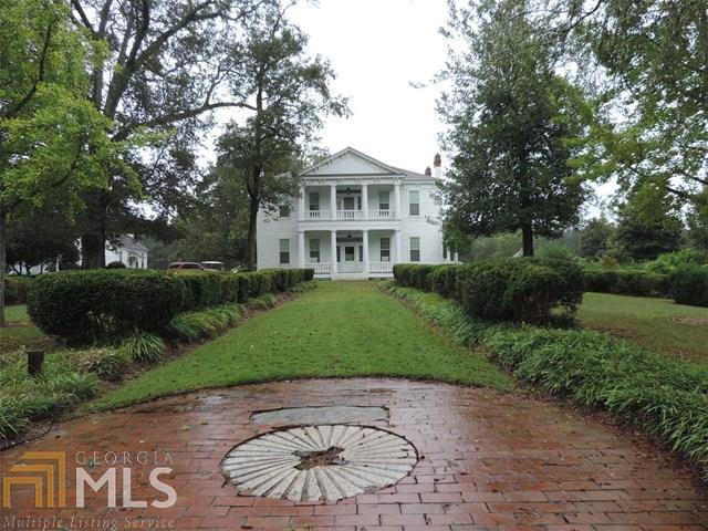 This 1835 Federal-Style home listed on the National Historic Register is the original home of Hiram Warner, founder of Greenville, GA. This 5/4.5 beauty has 1/2" heart-pine floors throughout; updated kitchen and living areas; 10 f/p (all work); 3 drilled wells on site w/elec pump; 1400 gal tank portable generator; freshly painted exterior 2013; new windows throughout 2013 w/warranty; Home Warranty; Roof 15 years main house; 2 years all other bldgs; Guest House complete with kit/bath (Obidiah House) & F/P; 3 HVAC units (2 replaced w/in last 10 yrs); bdrm w/full bath on main level; Master 2nd level w/large walk-in closet; garage separate from house; barn w/adjacent 500 gal fuel cell; tools and equipment may be purchased separately. Priced to sell;