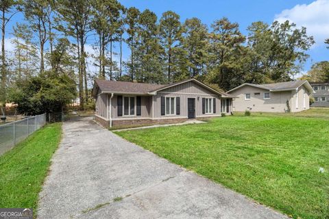 Photo of 6645 Hidden Brook Trail, Atlanta, GA 30349 (MLS # 10622799)