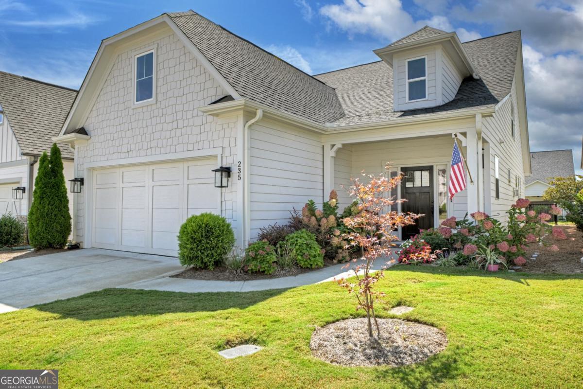 Upgrades Galore in this LIKE NEW home in Grandview at Gateway - North Georgia's Premier 55+ Active Adult Community! This beautifully upgraded 2-bedroom, 2.5-bath home also includes a versatile home office/sitting room (also provides option for a 3rd bedroom). You'll love the open concept layout featuring a gas log fireplace, crown molding, a well-appointed kitchen with quartz countertops, vent hood, stainless appliances (new refrigerator), soft-close cabinets & pantry. The generous primary suite offers a tile shower and a large walk-in closet that wraps around to the spacious laundry room including a utility sink and built-in cabinets. Enjoy the relaxing screened-in porch and level fenced in yard complete with privacy fence. 2-car garage and numerous custom features not found in other homes, extras include custom cabinetry, plantation shutters, Aprilaire purification system, foam insulation & more. This one is truly MOVE-IN READY! Grandview's resort-style amenities include a clubhouse, pool, fitness center, pickleball, yoga, game room, dog park, lake, community garden, hiking trails, and more. HOA covers cable, high speed WiFi, trash pickup, and lawn care. This is a "Lock and Leave" Lifestyle at its Best, you can travel for a week, a month, or a season knowing your home and yard are cared for. (Close to everyday essentials: Kroger, Walmart, Publix, CVS, and within minutes of Piedmont Mountainside & Northside Cherokee Healthcare.) Grandview at Gateway feels like a vacation destination, it's secure, community-oriented, and amenity-rich for active adults. Whether you're loving social events, staying active, enjoying mountain scenery, or just relaxing by your screened porch, this community offers that lifestyle.