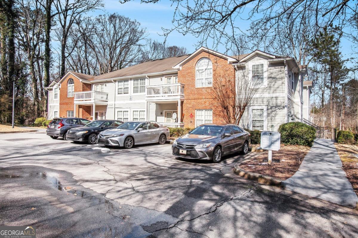 Welcome to 4008 Orchard Hill Terrace, a renovated condo that proves big style really does come in smart packages. Step inside and be greeted by massive high ceilings that make this 2 bedroom, 2 bath home feel anything but ordinary. The open living and dining area flows seamlessly, complete with hardwood floors and a cozy fireplace that practically begs for movie nights or lazy Sundays. The kitchen is updated and ready to keep up with you-featuring sleek countertops, plenty of cabinet space, and all the appliances you need to cook like a pro (or just reheat takeout in style). The primary suite is a true retreat with a generous walk-in closet, while the second bedroom doubles as the perfect guest room, office, or whatever space your life demands. Practical perks include a separate laundry room and central heating and air. All this in a well-kept community that's minutes from Stone Mountain Park, Dekalb Farmers Market, Emory, CDC, and with easy access to I-20, I-285, and I-85. Add MARTA and the airport to the mix, and you'll wonder how you ever lived anywhere else. Affordable, updated, and move-in ready!