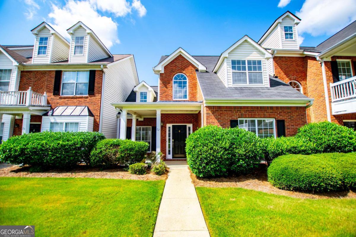 Rare find in Turtle Cove! Established townhome community offering a low-maintenance lifestyle near city conveniences. Private fenced-in patio and rocking-chair front porch are perfect for relaxation. Spacious floorplan with open living space with cathedral ceilings, master on main, and attached garage. The owner's suite features a walk-in closet and ensuite with separate shower, and tub. A guest half bath and laundry area completes the main floor. Additional bedrooms located on upper level providing privacy and versatile loft area, perfect for office or TV space, along with a full bath. Townhome overlooks large greenspace courtyard and is near Greenbelt and minutes from UWG and Carrollton Square. So much to offer in a fantastic location!