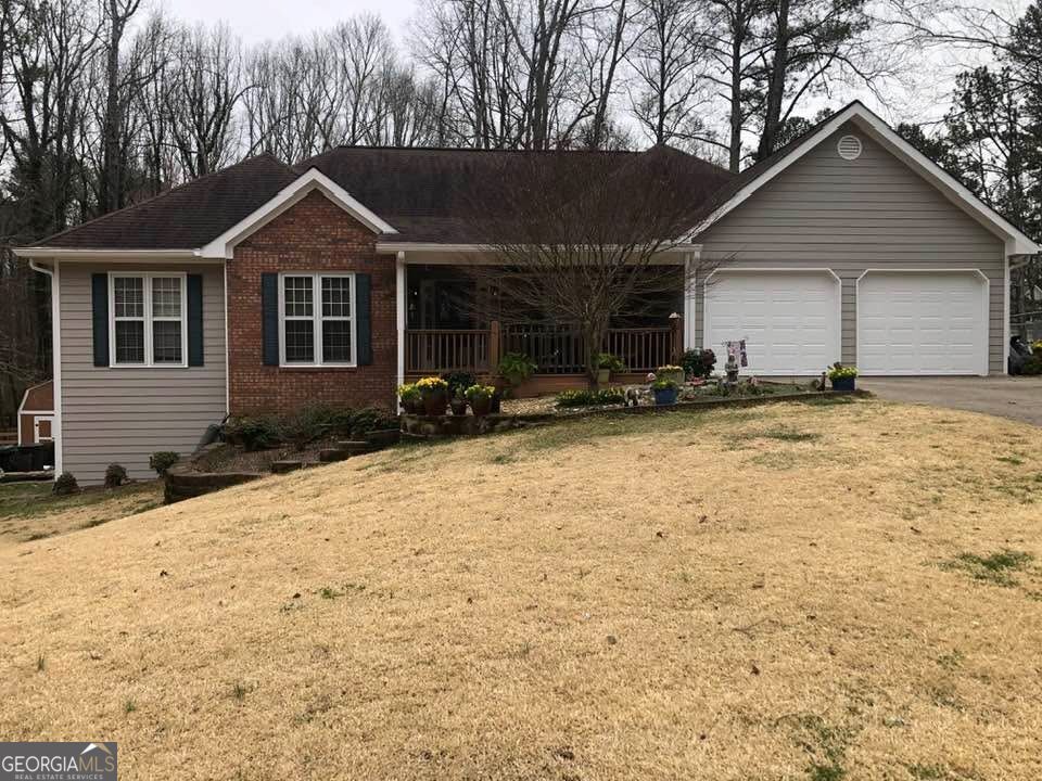 Nestled within the welcoming community of Cumming, GA, at 3305 Cove Creek Lane, this inviting home stands ready to welcome its new owners. This property presents an exceptional opportunity to embrace comfortable living in a residence that is ready to move in. The ranch-style layout of this home offers a harmonious design, encompassing 1893 square feet of living space. Imagine relaxing on the porch, perhaps with a morning beverage, enjoying the peace of the surrounding area. Built in 1988, this residential property encapsulates the charm of its era. This home is more than just a structure; it is an inviting place to create lasting memories. Weissman Law Cumming office is the preferred closing attorney. No showing until Sunday 9/14/2025.