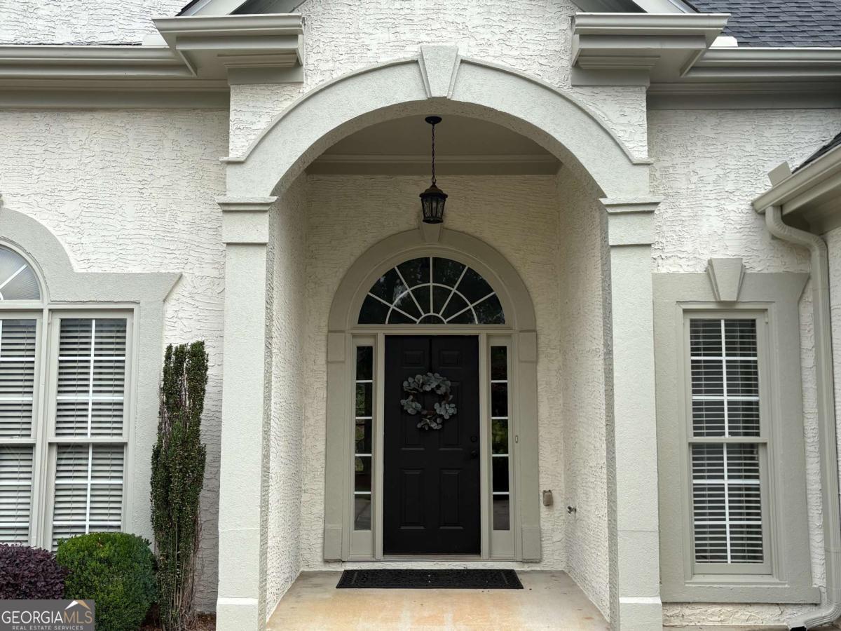 Executive-Level Living in a Prime Location! Experience the perfect blend of luxury, comfort, and convenience in this beautifully appointed 4-bedroom, 3.5-bath executive residence. Designed with modern living in mind, this home features rich hardwood floors throughout the main living areas, upgraded designer lighting, and a thoughtfully crafted layout ideal for both everyday life and entertaining. The gourmet kitchen is a true centerpiece, showcasing sleek quartz countertops, stainless steel appliances, ample cabinetry, and high-end finishes sure to impress any home chef. The open-concept design flows seamlessly into spacious living and dining areas, creating a warm and inviting atmosphere. The luxurious primary suite offers a peaceful retreat with a spa-inspired en-suite bathroom. Two additional bedrooms share a stylish Jack-and-Jill bathroom, each with generous closet space and soaring ceilings. Upstairs, you'll find a private fourth bedroom, a full bath, and walk-in attic storage - perfect for guests or a home office. Additional features include an EV charger for eco-friendly convenience and abundant storage throughout the home. Located in a sought-after neighborhood with easy access to major highways, top-rated schools, shopping, and dining, this home delivers upscale living at its finest. Shown by appointment only. Small pets allowed with a pet deposit and monthly fee. Optional yard maintenance and weed control service available for an additional monthly charge.