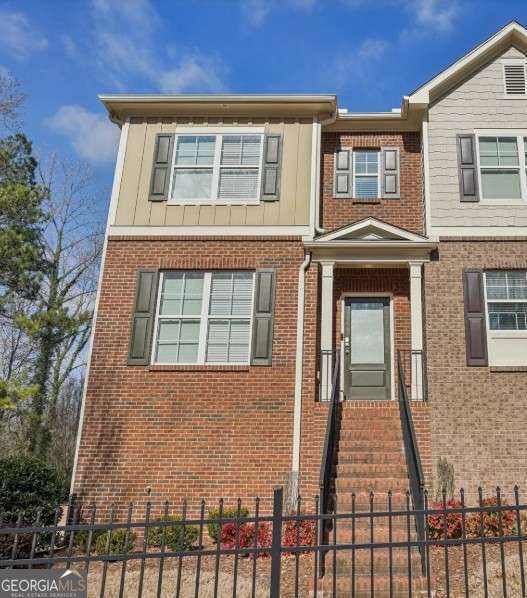Welcome home to this beautifully maintained fully furnished , all utilities included 3-bedroom, 3.5-bathroom townhome in the heart of Smyrna, GA! A coveted end unit, this home boasts an open-concept layout perfect for modern living. Step into the dining area and kitchen, which features granite countertops, a spacious island with a breakfast bar, and a brand-new dishwasher. An inviting fireside living room, framed with elegant built-in bookshelves and direct access to a private balcony-ideal for morning coffee or evening relaxation. Upstairs, retreat to the primary suite with trey ceilings, a spa-like en-suite bath complete with a soaking tub, separate shower, and double vanity, plus a generous walk-in closet. A second bedroom also boasts its own private bathroom and walk-in closet. The lower level offers a third bedroom with a full bath, ideal for a home office, gym, or guest suite. Parking is a breeze with a 2-car garage and a driveway that accommodates two additional cars. There is also a new water heater for added convenience! Located in an excellent community with easy access to shopping, dining, The Battery, and major highways, this townhome is a must-see! Don't miss the chance to make it yours-schedule a showing today!