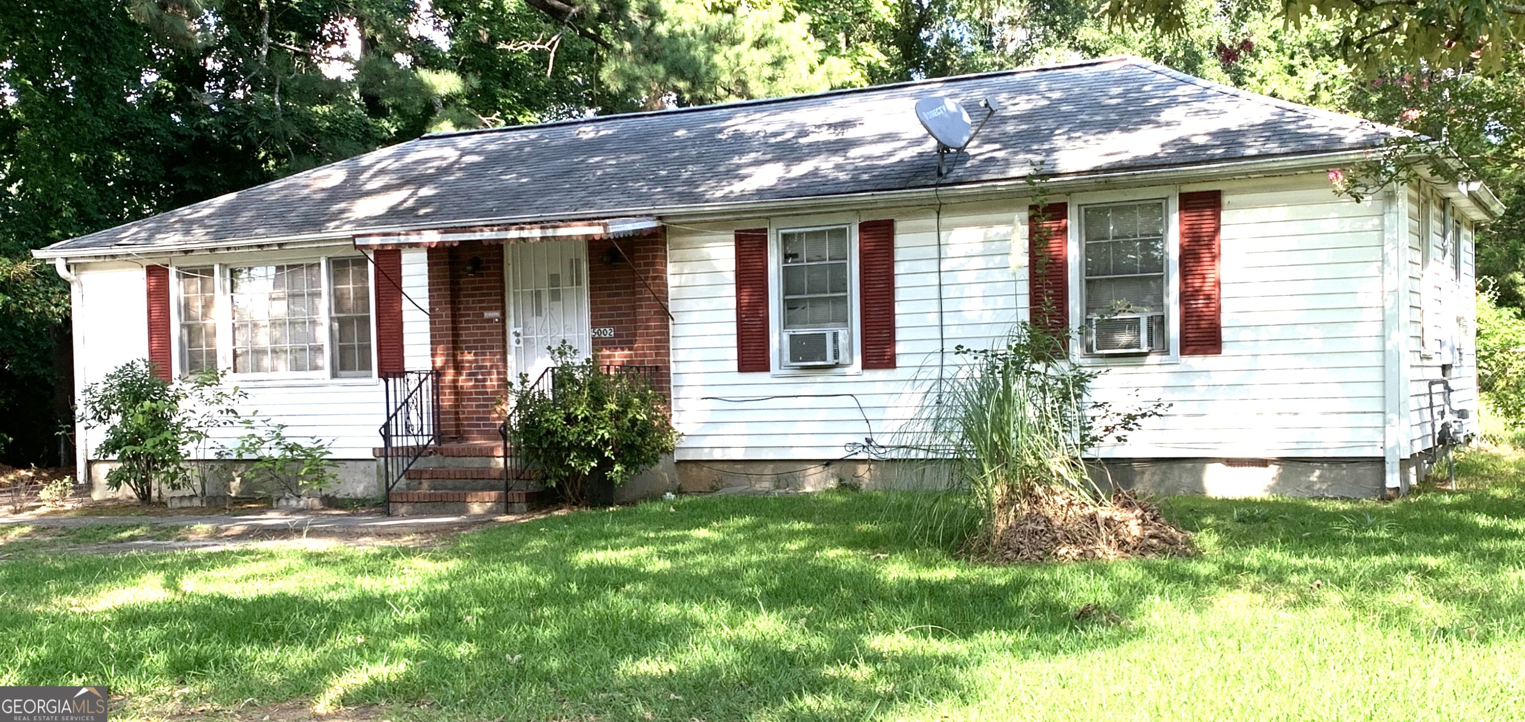 Spacious Charming house- Ready for your finishing touches. Nice size private mostly fenced-in backyard. Nice long driveway for plenty of parking. Original hardwood floors throughout the entire house. Separate Dining Area and entertaining family room. Full Kitchen with appliances and spacious cabentry. Home and yard is large enough to expand to make it even bigger. 100% Financing available with Preferred Lender, 1% Down Mortgage Program - Georgia Platinum Mortgage - Therese Upshaw-678-591-1358. For Questions and showings call - Trisha Spicer at 678-615-0549, thespicerteam@gmail.com, Or use Showingtime.