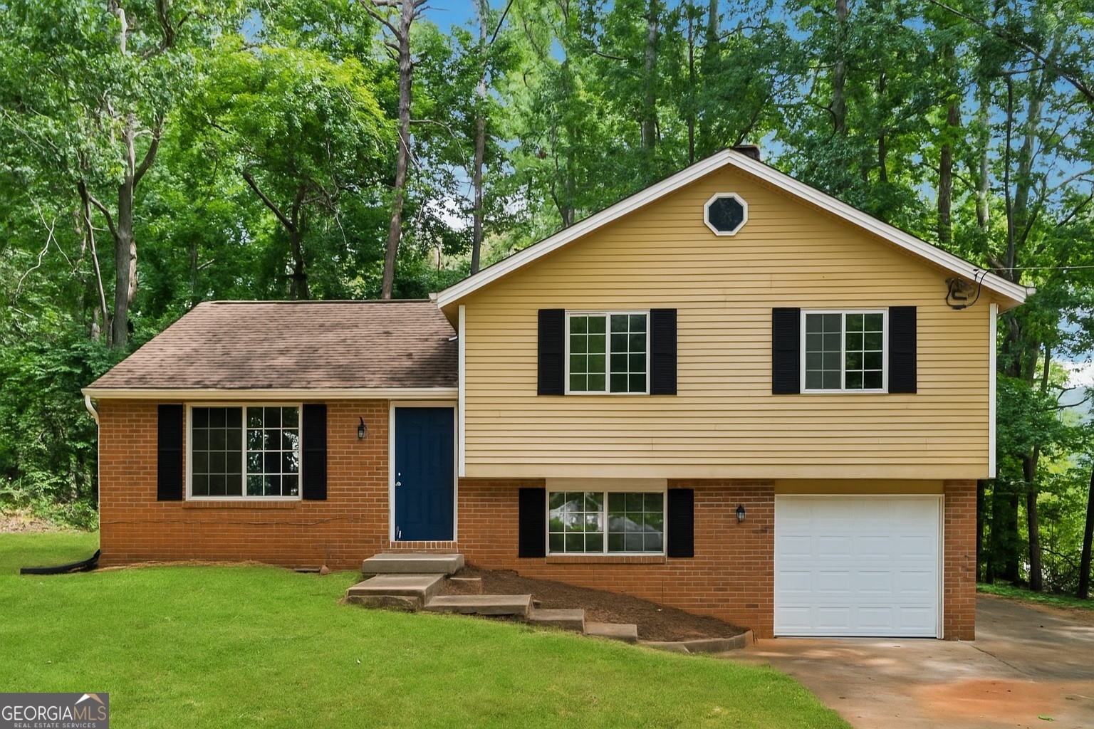 Discover your ideal home at 1984 Singer Way, Lithonia, GA 30058, a charming residence nestled in a sought-after neighborhood. This inviting home boasts a fresh and modern interior with newly painted walls, creating a bright and welcoming atmosphere. Situated on a spacious corner lot, the property offers excellent curb appeal and ample outdoor space. Step outside to the relaxing rear deck, perfect for hosting gatherings or enjoying quiet evenings. The home features a convenient garage, complete with a brand-new door and opener for secure and easy access. Inside, a versatile space awaits, ideal for use as a cozy sitting area or a productive home office, highlighted by a warm brick fireplace that adds character and charm. Stay comfortable year-round with a new exterior HVAC unit. Don't miss the chance to own this beautifully updated home, blending style, comfort, and functionality in a prime Lithonia location. Schedule a showing today to experience all that 1984 Singer Way has to offer!