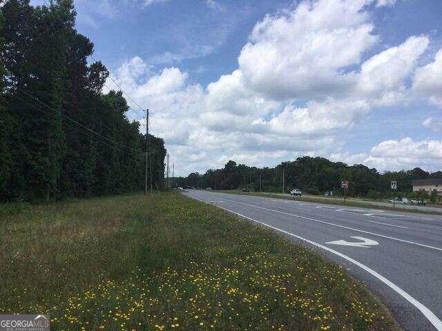 EXCEPTIONAL OPPORTUNITY FOR AN INVESTOR/USER for this 13.0 acre tract! Currently Zoned C O  this HIGHLY VISIBLE CORNER TRACT offers unlimited possibilities for a future development; offering 481.48 Hwy frontage on Hwy 54 & 605.80 on Huiet Drive. The tract is very level, wooded with vegetation; no structures on property.  This property is located in the fast growing Highway 54 West Corridor between Fayetteville and Peachtree City.  Across the street is the new Georgia Bone & Joint Medical Facility, Gym South Facility & Smith-Davis Clothing Store.  NEW Data Center @ Tyrone Road. The location could not be better!  Within minutes of Piedmont of Fayette Hospital, Trilith/Pinewood Studios, UPCOMING U.S. Soccer Training Complex Fayetteville and Peachtree City. Access roads near the property are Tyrone Road, Sandy Creek Road, Veterans Parkway, Lester Road, Huiet Drive, Ebenezer Road and more!  This location is near churches, schools, restaurants and minutes from numerous activities.  The property is currently zoned C O&I according the Fayette County.  Preferred closing attorneys:  Slepian, Schwartz & Landgaard, Peachtree City,  Ga.  Please call agent for any questions or information.