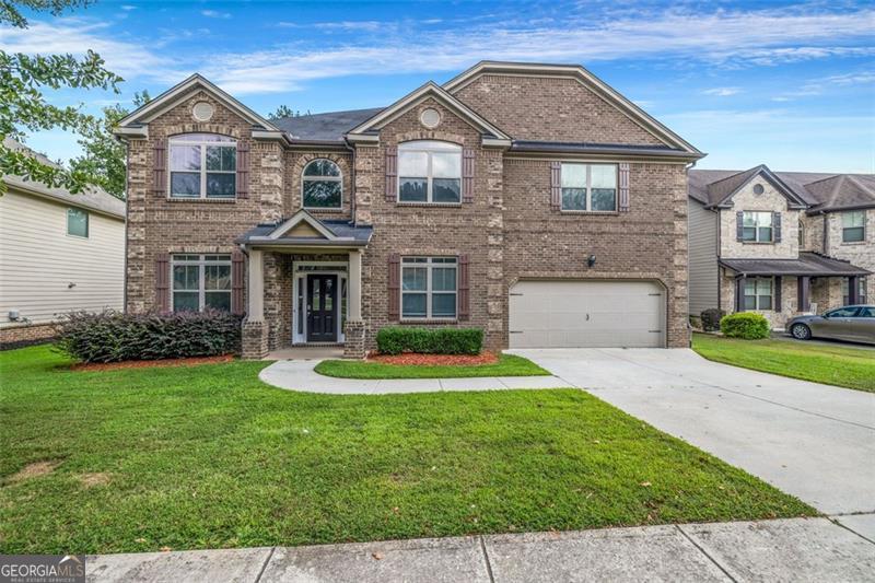 Welcome to 2897 Austin Common Drive This 5-bedroom, 4-bath home in the sought-after Austin Commons community offers over 4,200 square feet of living space designed for both comfort and elegance. As you enter, the grand two-story foyer makes a lasting impression with its detailed trim work and arched openings that flow seamlessly into the living areas. Beautiful hardwood floors, abundant natural light, and a coffered ceiling add warmth and sophistication to the main level. The gourmet kitchen is the heart of the home, featuring granite countertops, stainless steel appliances, a gas cooktop with pot filler, and an oversized island perfect for casual dining or entertaining. The adjoining keeping room with fireplace and the open family room create the ideal gathering spaces. A bedroom and full bath on the main level provide convenience for guests or multi-generational living. Upstairs, the expansive owner's suite is a true retreat, complete with a sitting area, spa-like bath with dual vanities, soaking tub, separate shower, and a generous walk-in closet. Secondary bedrooms are spacious with access to well-appointed baths, and a large bonus/media room offers flexibility for work or play. Step outside to enjoy a private backyard with a patio, perfect for outdoor dining and relaxation. Located close to shopping, dining, schools, and major highways, this home combines luxury, space, and convenience in one of the area's most desirable neighborhoods.