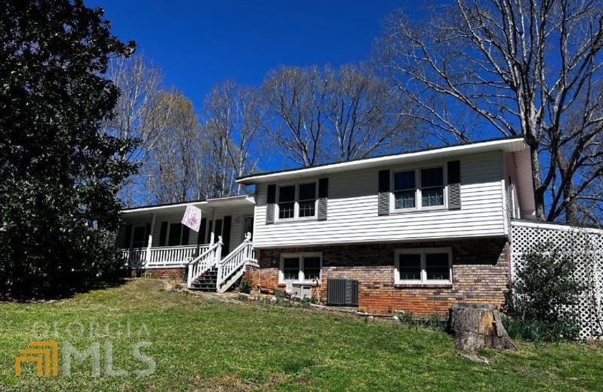 This great home is ready for new owners. Sitting on 1.57 acres this home offers 3 bedrooms/3 baths & has so much to offer! A cozy living room and bright kitchen with a cute breakfast area or reading nook! A great closed in porch and a spacious family room. The workshop in the basement is very spacious for all your tools! The roof is less than a year new. The backyard is a gardener's dream and has two outbuildings with electricity. This home is walking distance to Woodland Hills Golf Club, minutes to Cartersville Airport, Dallas Hwy and I-75.