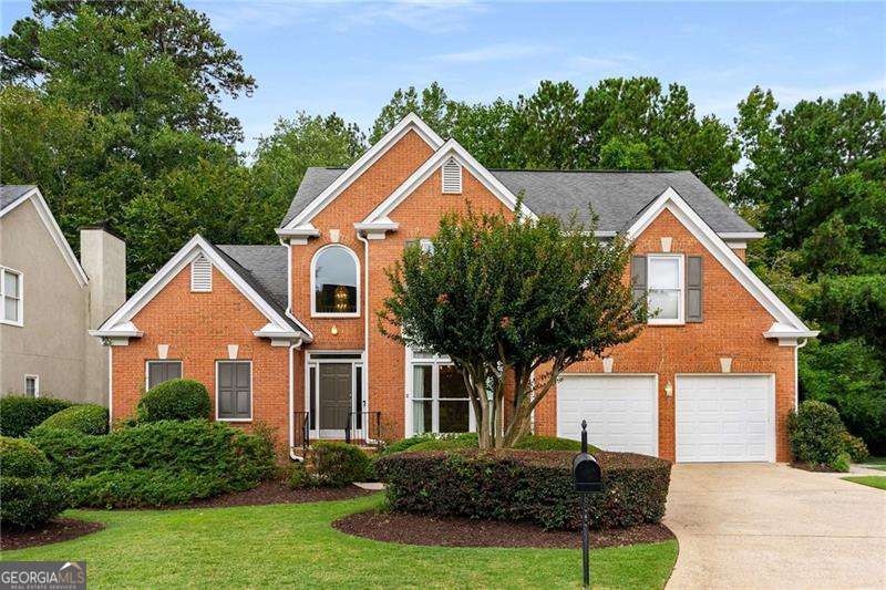 Welcome to 2381 Briarleigh Way- an impeccably maintained Pulte resale nestled in a tranquil, nature-filled setting in the heart of Dunwoody. This updated home features a sought-after primary suite on the main level and a fantastic, flowing floorplan. Step into the soaring two-story great room, the stunning centerpiece of the home, filled with natural light. The spacious kitchen opens to a fireside keeping room and overlooks a lush, private backyard. Entertain with ease in the oversized dining room with a dry bar, perfect for hosting. The luxury primary suite offers deck access, a spa-like bath with a whirlpool tub and oversized shower, plus a custom walk-in California closet. Upstairs are three well-sized secondary bedrooms and a full bath. The home lives beautifully as a single level with space above and a full unfinished terrace level below for future expansion or ample storage. Enjoy coffee or cocktails on the expansive deck surrounded by woods, a peaceful creek, and abundant nature- your own private oasis.