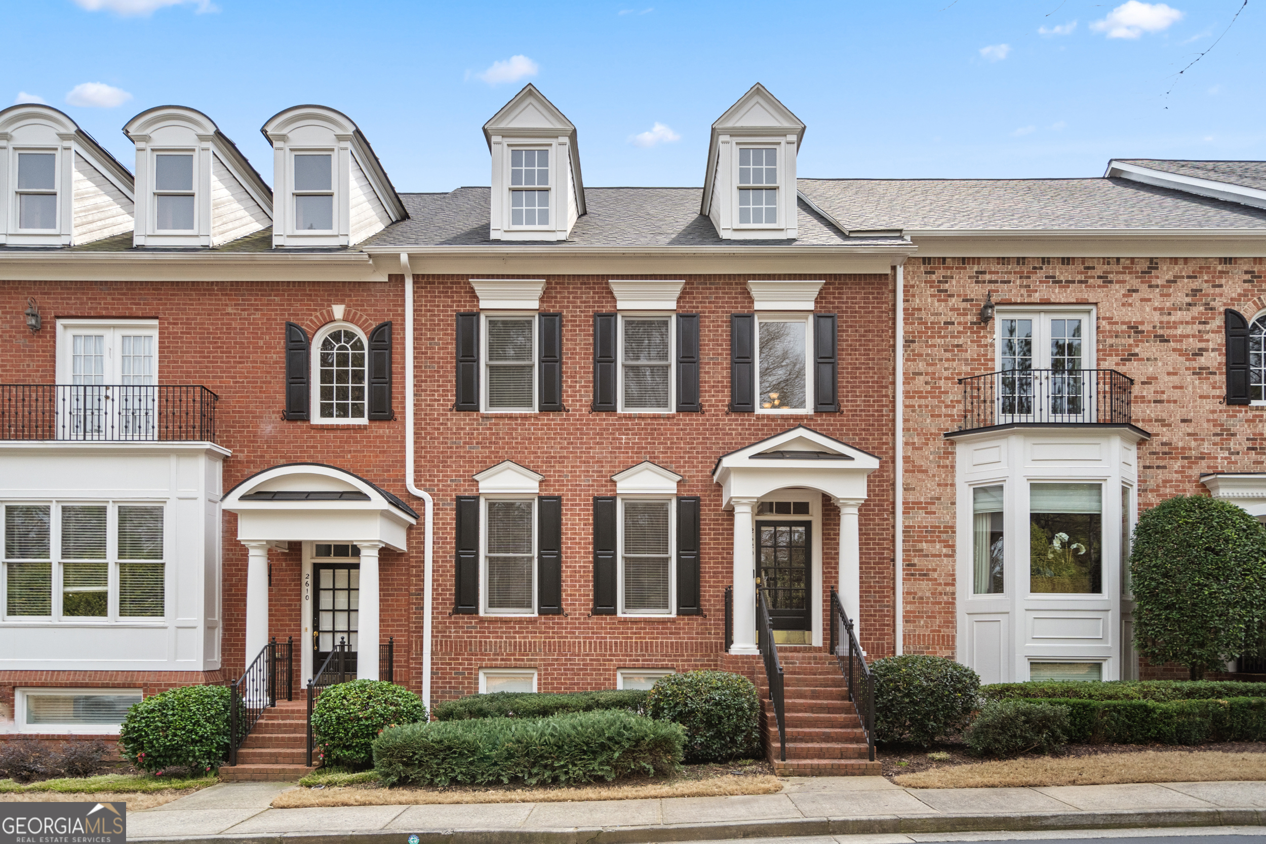 Welcome to this beautiful brick Townhome in the gated and highly sought-after swim/tennis John Weiland community of Academy Park. Experience living in this prime Alpharetta location with the added bonus of premium community amenities! This home is in a quiet and serene setting in downtown Alpharetta featuring a junior olympic pool, tennis, pickle ball, clubhouse, fitness center, and a walking path through acres of preserve hooking up to the Alpha Loop! Compare the price, location and amenities with other downtown properties to see the great value offered in this lovely home within walking distance of downtown Alpharetta restaurants, shops and minutes from Avalon! This home is truly better than move-in ready with newly refinished hardwood flooring throughout the main floor, brand new carpet, brand new AC unit, furnace and water heater. The upper level features an expansive primary suite flooded with natural light with hers and his walk in closets creating the perfect retreat. This suite includes a luxurious ensuite bathroom with dual vanities, a spacious walk-in shower, and a large soaking tub. Dues cover all exterior maintenance including painting, roof, front yard landscaping and upkeep, trash pick up and on site community manager! Don't miss the opportunity to make this fantastic residence your new home!