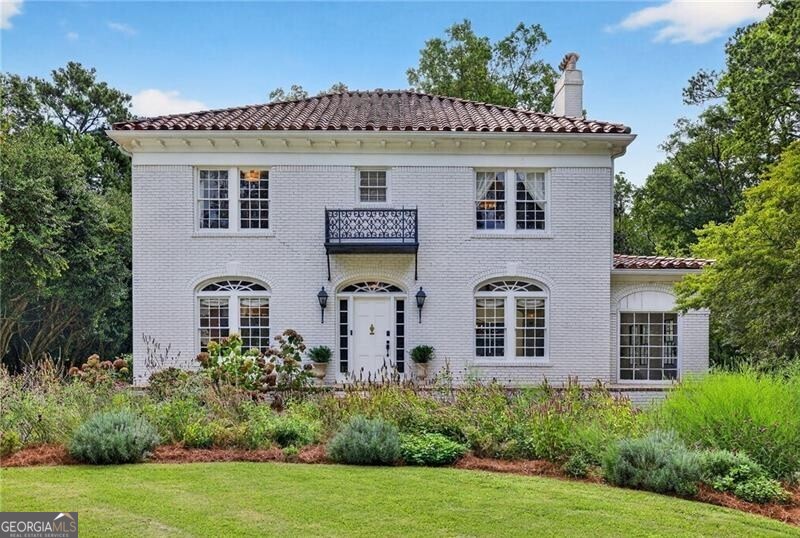 Expanded and beautifully reimagined in the heart of historic Druid Hills, this 5-bedroom, 3.5-bath residence captures the enduring elegance of its era while offering a seamless blend of historic character and modern sophistication. Thoughtful design and quality craftsmanship shine throughout, from the impeccable renovation to the curated expansion that honors the home's architectural pedigree. The main level is anchored by a luminous living room and a gracious dining room that flow effortlessly into a stunning kitchen featuring honed Calcutta marble, abundant counter space, and custom details that elevate daily living and entertaining. A luxurious primary suite on the main floor offers a private retreat. Upstairs, three spacious bedrooms share a full bath, along with a versatile bonus room ideal for study, office, or creative pursuits, and the potential for a primary suite on this level as well. The lower level provides a full bedroom and bath, while an enormous unfinished basement offers extraordinary potential for future expansion. Throughout the home, natural light pours through large windows, highlighting beautiful hardwood floors, exquisite lighting selections, and marble-accented baths that marry classic elegance with modern comfort. Set on a treasured stretch of Oxford Road-known for its quiet character, stately homes, and little to no through traffic-this property enjoys a prominent corner lot where organic landscaping has been cultivated to attract butterflies and create an enchanting natural setting. Mature trees, vibrant plantings, and thoughtful garden design provide both privacy and beauty, inviting moments of outdoor living and entertaining. This is more than a home: it is part of the extraordinary history of Druid Hills, a neighborhood envisioned by Frederick Law Olmsted and celebrated for its tree-lined streets and timeless architecture. Here, you are minutes from Paideia, Fernbank Elementary, Emory University, vibrant Emory Village, and the Druid Hills Golf Club. With its abundant natural light, gracious proportions, quality construction, and meticulous renovation, this residence offers both historic soul and modern sophistication-a rare opportunity to own a piece of Atlanta's architectural legacy in one of its most beloved neighborhoods.