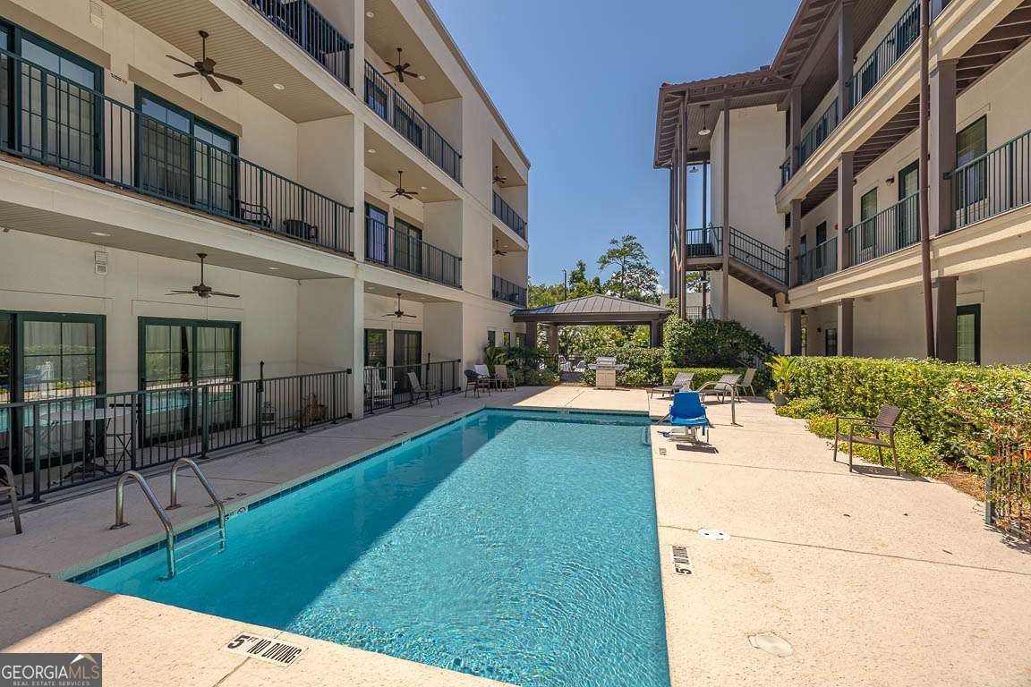 This 1-bedroom condo is a golden opportunity right in the heart of St. Simons' Pier Village! Whether you're looking for your own beachy getaway, a full-time island condo, or a solid vacation rental, this place checks all the boxes. Just a flip-flop stroll to the beach, pier, parks, shops, and local eats no car needed! Fully furnished and ready to go, this charming unit comes with a roomy kitchen, comfy living area with pull-out sofa, separate KING bedroom and bath, laundry, and a spacious covered porch perfect for morning coffee or sunset cocktails. The complex features a sparkling pool for cooling off after sandy adventures, and the HOA covers utilities and more. Easy living at its finest! Very popular vacation rental!!