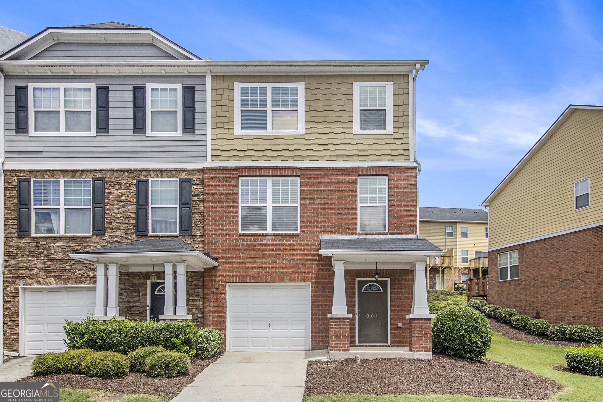 Welcome to this well-appointed 2-bedroom, 2.5-bathroom end-unit townhouse ideally located in a prime Lawrenceville location with unbeatable access to Hwy 316, I-85, the Mall of Georgia, and Sugarloaf Mills. This home offers the perfect blend of comfort, convenience, and low-maintenance living in a sought-after community with fantastic amenities. Step inside to an open and inviting floor plan featuring a spacious family room and dining area, perfect for entertaining or relaxing. The kitchen boasts stained cabinetry, quartz countertops, stainless steel appliances including a gas range, and a breakfast bar that seamlessly flows into the living space. Upstairs, you'll find two generously sized bedrooms, each with their own walk-in closet and private bath. The primary suite features a tray ceiling, double vanity, separate soaking tub and shower, and ample closet space. The laundry room is conveniently located on the upper level for added ease. The finished basement adds valuable bonus space with a flex room ideal for a home office, gym, or media area, plus a half bath for guests. Enjoy outdoor living and neighborhood strolls with community walking trails, a playground, and a sparkling swimming pool. The HOA maintains the exterior and yard, giving you more time to enjoy all this home and location have to offer. Whether you're a first-time buyer, downsizing, or looking for an investment, this move-in ready home offers the best of convenience and lifestyle in a thriving area.