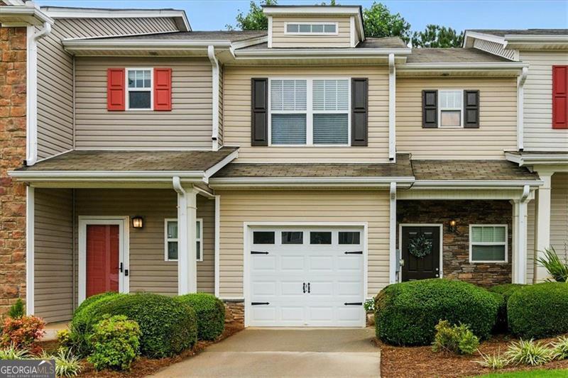 This meticulously maintained 3-bedroom, 2.5-bathroom, one car garage townhouse in Acworth, GA, offers a perfect blend of comfort and convenience. With 1,506 square feet of living space, this home provides ample room for relaxation and entertaining. Step inside to discover new wood floors that flow throughout the home, adding a touch of elegance and warmth. The kitchen, designed with an open concept, seamlessly connects to the living room, creating a perfect space for gatherings and everyday living. From the dining area, breeze through the sliding doors to a cozy patio where you can relax and be at one with nature. Upstairs, you'll find three spacious bedrooms, two full baths, and a conveniently located laundry room, which includes a washer and dryer for your immediate use. The home's brand-new HVAC system, installed in 2024, boasts dual-zone thermostats, ensuring optimal comfort on each floor. Beyond the walls of this charming townhouse, the neighborhood offers fantastic amenities, including a refreshing pool and a fun-filled playground, providing endless opportunities for recreation and leisure. Acworth, GA, is known for its blend of suburban charm and easy access to modern conveniences, making it an attractive location for families and individuals alike. Enjoy the serenity of nearby Lake Acworth and Lake Allatoona's scenic waterfront, or explore the revitalized downtown district, offering a vibrant mix of dining, culture, and community events. With its prime location, modern updates, and inviting atmosphere, this townhouse is an ideal place to call home. The HOA covers pool, playground, common areas, termites, lawn care, weekly trash and recycle pick up, as well as exterior maintenance of the home.