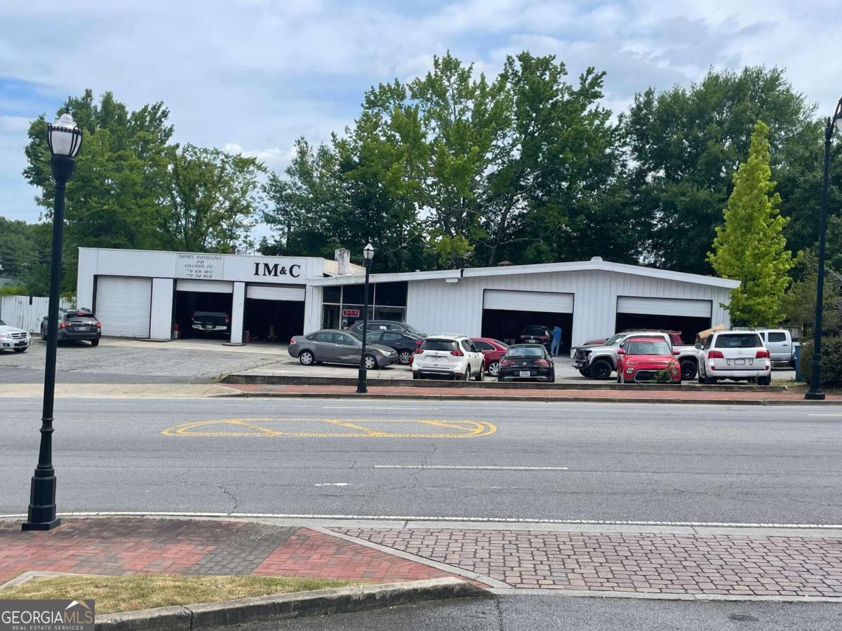 Prime corner lot in the heart of the growing Historic area of the City of Marietta. Located at the corner of Roswell Street and South Avenue, this .424 acre parcel provides the coveted access businesses want for dual access. The listing includes the .424 acre of land and 3514 s/f building. The business is not for sale. This property is the perfect investment opportunity in this growing area or has an unmatched location to locate your expanding business.