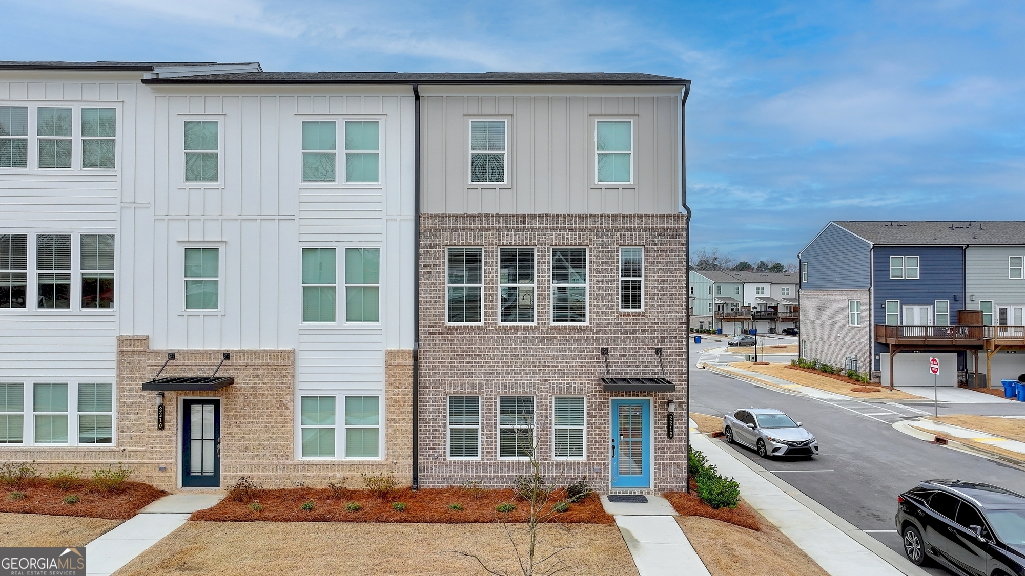 This exquisite three-level townhome, nestled within the desirable Lawrenceville, Georgia community of The Beacon at Old Peachtree, offers an ideal location that balances convenience and lifestyle. Featuring an open floor plan and contemporary design, the home seamlessly blends style with functionality. The main level boasts a spacious kitchen equipped with a large island, perfect for both everyday living and entertaining. Its generous layout allows for effortless gatherings with family and friends, whether sharing meals or celebrating special moments. The adjacent family room, highlighted by a cozy fireplace, offers a warm and inviting atmosphere, while the expansive deck provides the perfect outdoor retreat to enjoy the sunshine. On the upper level, two well-proportioned bedrooms share a full hallway bath, while the private primary suite serves as a serene retreat. This luxurious space includes a large walk-in closet and an en-suite bathroom, providing a peaceful sanctuary at the end of each day. For added convenience, the laundry room is located on the same level as the bedrooms. The lower-level recreation room offers versatile space that can easily be tailored to suit various needs, whether as a private office, additional family room, or playroom. Outside your door, there's an abundance of opportunities to explore. Spend a day shopping at the nearby Mall of Georgia, catch a game at Coolray Field, or enjoy weekends at local parks or golf courses. The Beacon at Old Peachtree also provides easy access to commuter routes, making both daily commutes and weekend trips effortless. Residents enjoy an active lifestyle with on-site amenities including pickle-ball and tennis courts, a walking path, and parks. With complimentary lawn maintenance, you'll have more time to relax by the neighborhood pool and cabana. Additionally, the townhome is part of a highly regarded school district, offering access to some of the best schools in Gwinnett County.