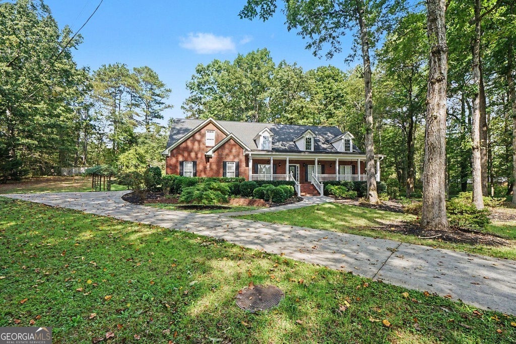 Photo of 1355 Old Loganville Road SW, Loganville, GA 30052 (MLS # 10875446)