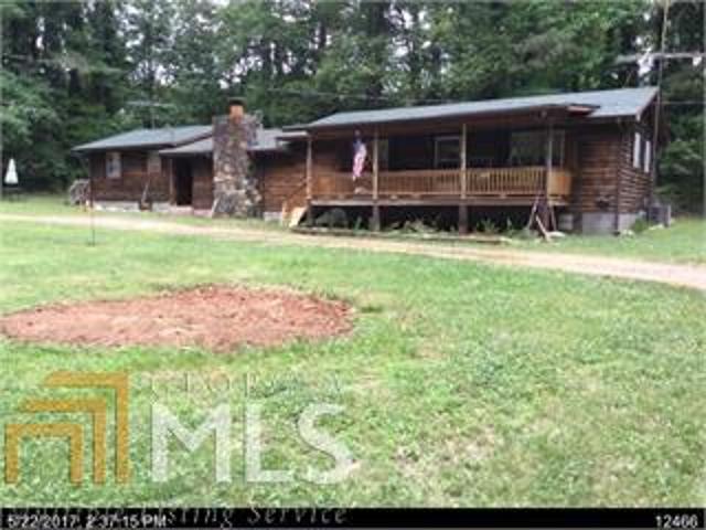 4BR/2BA Ranch on 1 Acre Lot, Covered Rocking Chair Front Porch, Rock Fireplace and Cathedral Ceiling in Great Room, Kitchen has Lots of Cabinet Space, Master on Main, Ceiling Fans, Second Kitchen, 2 Car Detached Garage, Sold As Is, $139,900.