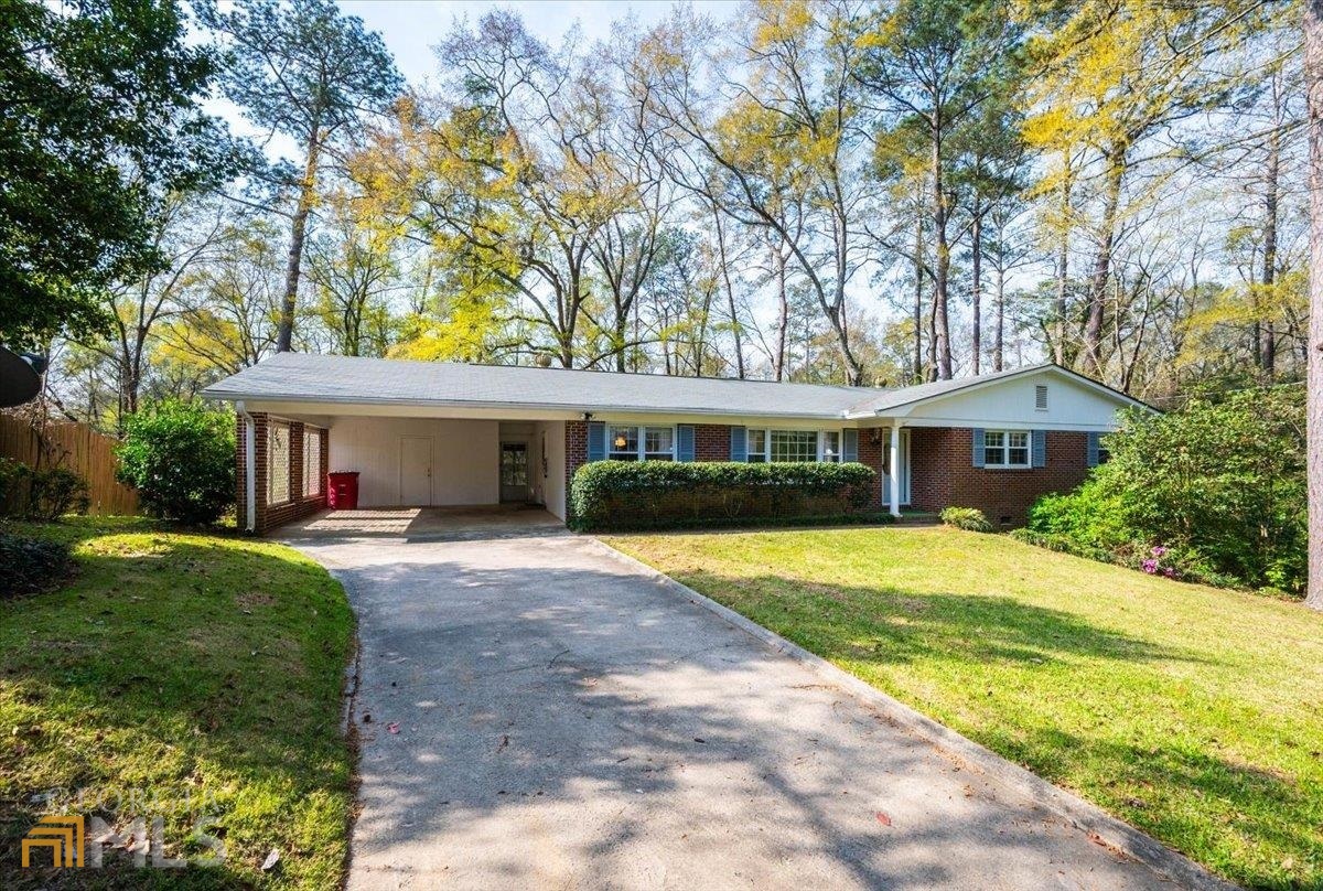 Secluded North Macon brick ranch has the prettiest landscaping and a screened porch that's perfect for cookouts. Situated on a big lot with great landscaping and a concrete path - it's a bird sanctuary back there! Hardwoods, a walkout basement, a carport . . . better hurry!