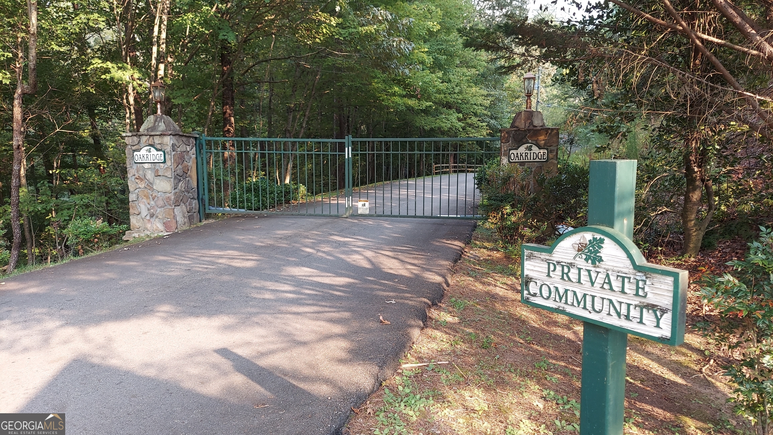 Looking for a building lot in East Ellijay? Don't' miss this opportunity to grab a little over an acre and a half in a gated community. Building restrictions prevent mobile homes, and anything under 1500 sq ft. Located near all the apple orchards and festivals, vineyards, 20 minutes to downtown Blueridge, hiking nearby, beautiful mountain community. You can build now, or hold the land until you are ready. Will need gate code, and all buyers must be accompanied by agent.