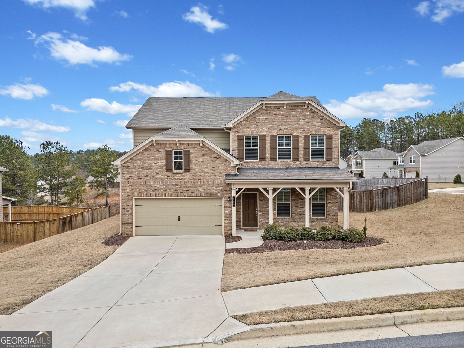 Welcome to 160 Northridge Drive, a stunning home built in 2021 and situated in the highly desirable North Paulding High School district. This modern 5-bedroom, 4.5-bathroom residence spans 2,758 square feet and features a bright, open floor plan with high ceilings, a gas fireplace, and luxurious plank flooring throughout. At the heart of the home is the spacious gourmet kitchen, complete with a large island with seating, stainless steel appliances, granite countertops, custom cabinetry, and a convenient walk-in pantry. Perfect for entertaining, the kitchen opens to the family room and dining area, which seamlessly leads to a covered porch overlooking the backyard. The main level also includes a versatile bedroom or office with an ensuite bathroom and walk-in closet, as well as a convenient half bath. Upstairs, you'll find the luxurious primary suite, which offers a spa-like bathroom with a soaking tub, separate shower, dual vanities, and an expansive walk-in closet. The second level also includes a secondary bedroom with an ensuite and walk-in closet, two additional bedrooms sharing a hall bath, and a convenient laundry room. Ideally located with easy access to I-75 and I-20, this home provides the perfect balance of comfort and convenience. Nearby, you'll find grocery stores, fine dining, parks, and upscale shopping, making this the perfect place to call home.