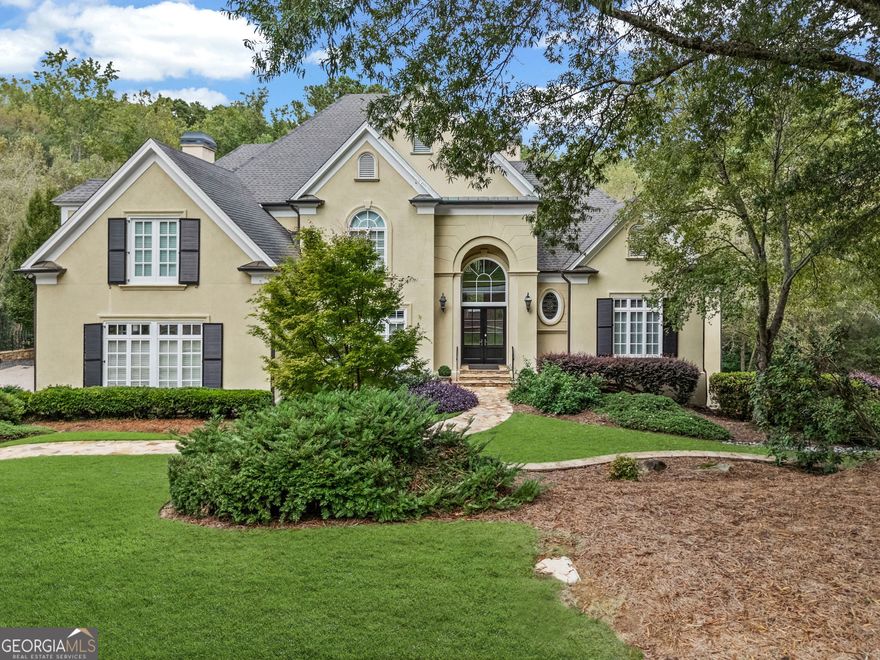 Nestled on a quiet cul-de-sac in the popular River Oaks neighborhood, 1655 Misty Oaks Drive in Sandy Springs offers the perfect blend of luxury, comfort, and location. Just a short walk to Island Ford Park and the Chattahoochee River, this elegant 5-bedroom, 4.5-bath executive home sits on nearly two acres of beautifully landscaped grounds. Thoughtfully updated, the home spans approximately 6,300 square feet of sophisticated living space designed for today's lifestyle. The main level features a grand foyer, formal dining room, fireside family room, and a richly appointed office or study. The fully renovated designer kitchen is a true showpiece, with Wolf, Thermador, Bosch and Sub-Zero appliances, Quartz countertops, custom cabinetry with Shelf Genie pull-out drawers, and an inviting breakfast area that opens seamlessly to the family room. A beautifully appointed wet bar and butler's pantry, conveniently located adjacent to the dining room, make entertaining effortless and elegant. The spacious primary suite on the main level offers a serene retreat with a spacious bath and custom-upgraded closets. Upstairs, 2 generous secondary bedrooms share a Jack and Jill bath while a third bedroom enjoys a private bath. The huge bonus room is a perfect children's playroom or study center. The fully finished terrace level is designed for entertaining with a billiard and game room, media area, wine cellar, guest suite, and abundant storage. Architectural details throughout this amazing home such as coffered ceilings, hardwood floors, built-in bookcases, and multiple fireplaces add to the home's timeless elegance. Modern conveniences include a central vacuum system, Generac generator, Level 2 electric car charger, nighttime moon lights and comprehensive security features. The outdoor living spaces are equally impressive, featuring new and upgraded landscaping, fenced back and side yards, and an expansive upper deck has been refurbished and enhanced with stylish metal railings. A waterproof system under the deck creates a dry, functional patio area below, ideal for entertaining or relaxing year-round. With its combination of high-end renovations, prime location, and elegant design, 1655 Misty Oaks Drive exemplifies refined suburban living in one of Sandy Springs' most sought-after communities.