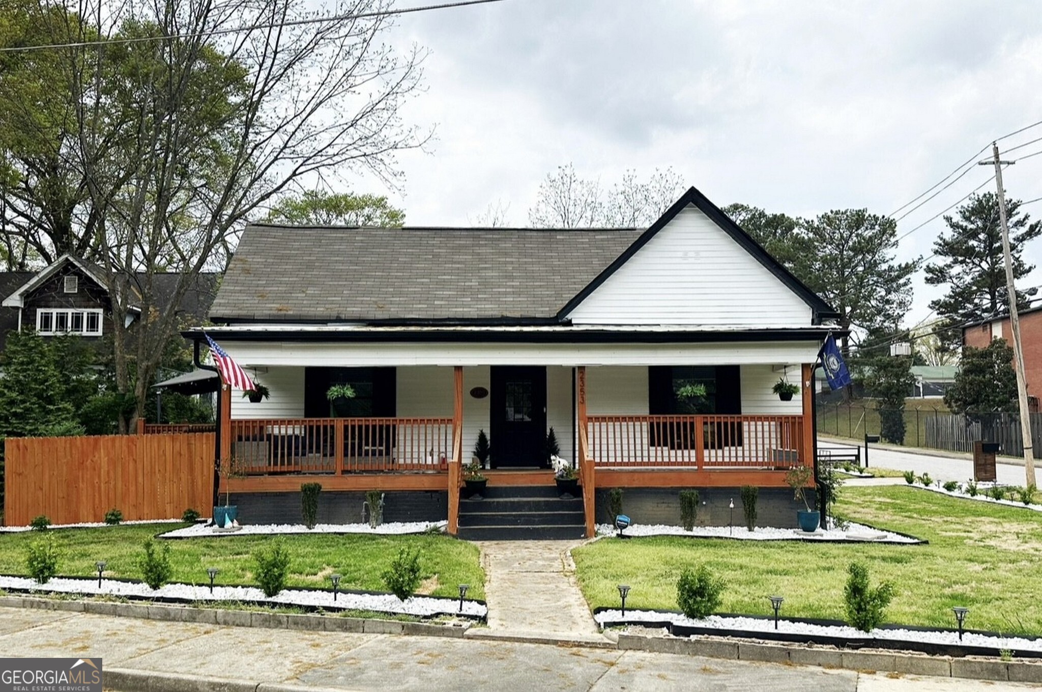 ASSUMABLE VA LOAN AVAILABLE - Ask how your buyer can take advantage of this incredible financing opportunity! Welcome home to this beautifully renovated 3 bedrooms/2bathrooms charming home in the Colonial Hills neighborhood in Historic East Point, where modern upgrades meet timeless character! Situated on a large corner lot, in a private cul-de-sac, this home has everything you are looking for! Be greeted by the huge rocking chair front porch, open floor plan living, 10-foot ceilings, new flooring throughout, and oversized windows that illuminate this spacious home with an abundance of natural light. The radiant living room offers convenient access to the newly added side deck, boasts an electric fireplace that sets the ambiance and flows perfectly to the impressive kitchen featuring recessed lighting, center island, custom shaker cabinets, granite countertops, and new stainless steel appliances. The large Owner's suite has his and hers closets and an amazing en-suite that features tiled flooring, double vanity, freestanding soaking tub, and a separate 6x4 ft glass enclosed tiled shower. The secondary bedrooms and bathroom are similarly spacious and luxurious. The home has been freshly painted inside and out and also has a brand new roof and gutters! With lots of green space and beautifully landscaped yard this home is ideal for entertaining, gardening, and pets. Enjoy the quiet of this great neighborhood while still being conveniently located within minutes to Downtown Atlanta, Hartsfield-Jackson Airport, Delta HQ, MARTA, Tyler Perry Studios, all major interstates, and several parks. A must see home that won't last long, schedule a showing to see it today! This is the one you wouldn't want to miss out on! This home is move-in ready and full of smart upgrades. The AC and heating system are brand new, the water heater and sump pump are just 1 year old, and the gutters and garbage disposal have recently been replaced. Enjoy added value with the washer and dryer and refrigerator included in the sale. A backyard storage shed offers extra space. With every detail attended to and no deferred maintenance, this is your opportunity to move into a home that's been truly cared for - all in a sought-after East Point location. Enjoy walkable streets, friendly neighbors, and a fast-growing community with new developments all around. This move-in-ready home is perfect for buyers looking for both value and location - a rare find in this price range!