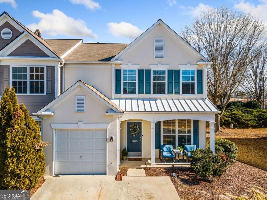 Meticulously maintained townhouse near the heart of Alpharetta! Perfectly positioned within walking distance of shopping and dining and just 2 miles from Avalon and 3 miles from Downtown Alpharetta. Start your mornings on the charming, covered front porch before entering the light-filled foyer. To your right, a formal dining room awaits, while straight ahead, the spacious living room, complete with a gas fireplace, creates the perfect space for relaxation. The open-concept main level features hardwood floors and an updated kitchen with crisp white cabinetry, quartz countertops, stainless steel appliances, and a cozy breakfast nook bathed in natural light. Sliding glass doors lead to a private back patio, perfect for outdoor dining or entertaining. Upstairs, the primary suite is a true retreat, offering a spa-like ensuite with a soaking tub, separate shower, double vanity, and a generous walk-in closet. Two additional bedrooms share a hall bath, and the upper-level laundry room adds everyday convenience. With a 1-car garage and oversized driveway providing plenty of guest parking, this home is as functional as stylish. Located in the highly sought-after Cambridge High School district, this home combines a prime location with modern comfort and thoughtful updates.