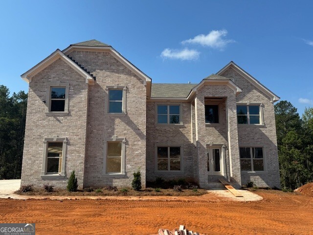 The Newport plan features 5 bedrooms, 4.5 baths, a three-car garage, and 4 side brick. On the main level are a formal living room, dining room, 2-story family room with coffered ceilings, large kitchen with extended island, pantry, gourmet stainless appliances, hardwood floors, a half bath, and a secondary bedroom with a full bath. Stairs with oak handrails with wrought iron spindles lead upstairs. Second floor features an enormous primary suite with a sitting room, three secondary bedrooms, and two full baths.
