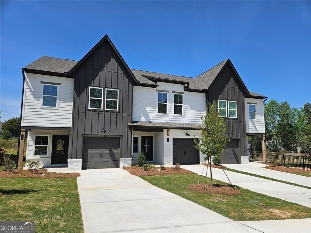 Seller is offering $15,000 in incentives! New Construction townhome in Downtown Dawsonville! Middle Unit, lot 8. One car garage with extra parking in the driveway. First floor is open concept with family room, powder room, dining area and a beautiful kitchen (Stainless steel appliances, pendant lights over the island, white cabinetry and granite countertops). Luxury vinyl flooring throughout the first floor. Second floor has 3 bedrooms. Huge master suite with walk-in closet is connected to the laundry room for convenience. The secondary bath has a split layout to allow multiple family members to get ready at the same time. This quiet community will have a total of 24 townhomes on a cul-de-sac road with streetlights, sidewalks and lawn care provided. Walk to downtown Dawsonville festivals and amenities including a schools, Lanier Tech, park, restaurants, grocery, and coffee shop! 10 minute drive to I-400, North Georgia Premium Outlets, Rock Creek Park and Atlanta Motorsports Park. Interior photos in listing are of similar townhome in the neighborhood.