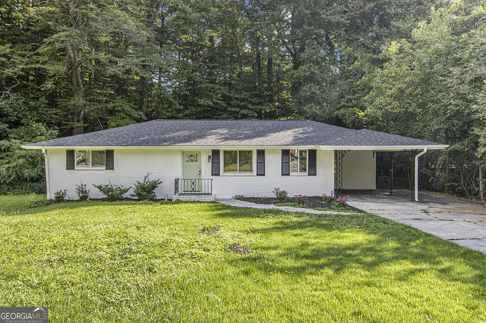 Welcome Home to this beautiful, fully renovated 3 bdrm 2 bath home. This traditional brick ranch sits on a flat, .56-acre partially fenced lot with peaceful wooded views and a backyard that feels like your own private retreat. It's tucked into a friendly, established community. This home has been opened up and thoughtfully updated for modern living. This home has beautiful hardwood flooring throughout, gorgeous marble flooring in the kitchen with stainless steel appliances, an island with a breakfast bar, and this layout fits your lifestyle. Renovated bathrooms feature dual-sink, marble vanity, beautiful tilework, and built-in cabinetry for all your storage needs. Two additional bedrooms sharing a second bathroom offer plenty of space to grow or host. A new Roof, hot water heater, and the AC unit were all installed in 2023. Out back, enjoy a large deck that's ideal for cookouts, coffee, or winding down at sunset. And the location provides quick access to Oak Grove, Briarlake Park, Emory, CDC, Toco Hills, I-85/75, GA 400, Buckhead, Downtown, and even the Airport. Everything you need is just around the corner. Please Show and Sell today!