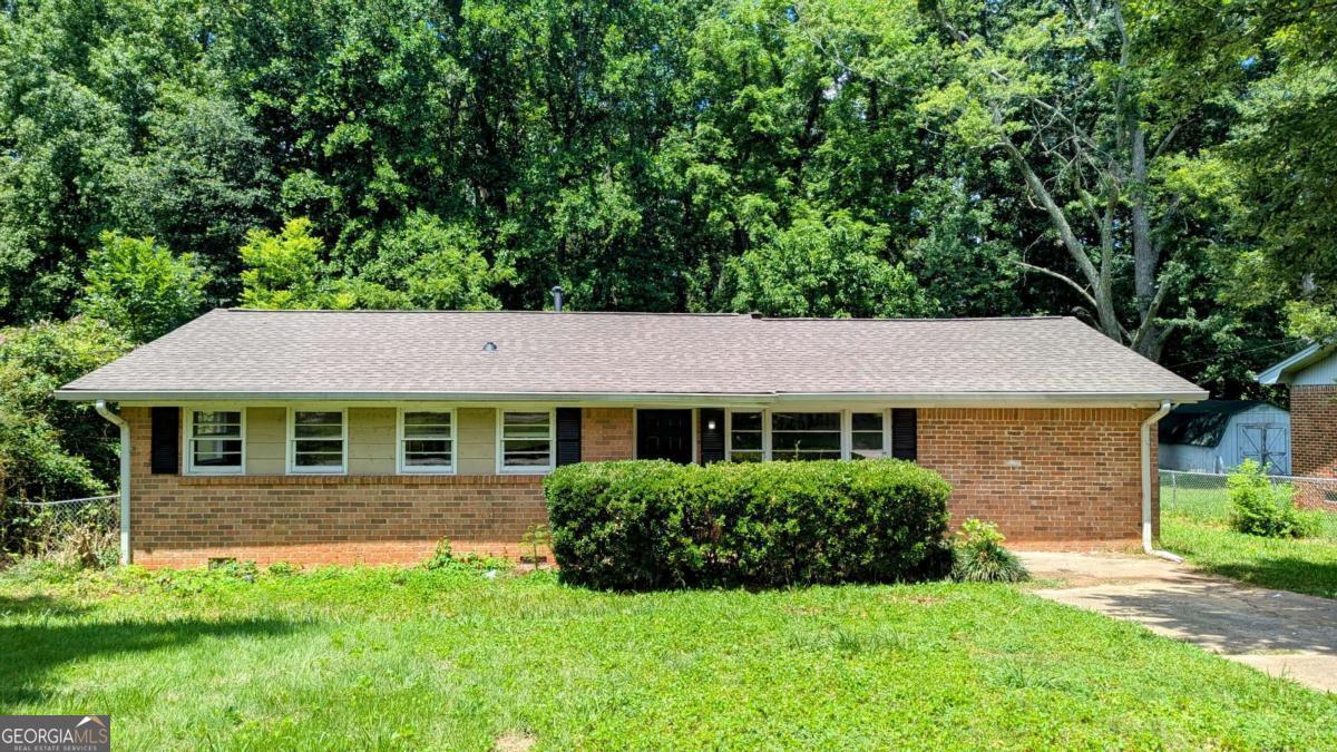Welcome home to this charming 3-bedroom, 1.5-bath brick ranch tucked away on a tree-lined lot. This move-in ready home features a bright and open layout featuring a living room and a family room. The kitchen opens to a spacious living area with a cozy brick fireplace-perfect for relaxing or entertaining. A side entry mudroom and/or laundry room provides extra convenience. Step outside to enjoy the large, fenced-in backyard with mature trees, a storage shed, and plenty of room for gardening or play. Situated on a crawl space with no HOA, this home offers both comfort and convenience. Agents: Please read private remarks/look at the offer guidelines in docs before calling, it should answer all questions you have.