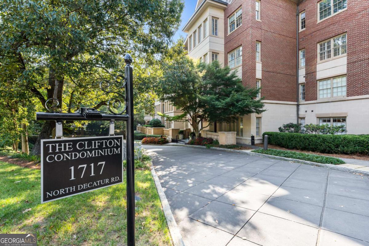 Luxurious Living steps from Emory University. The Clifton, a premier gated community offers a turn key lifestyle of modern comfort and timeless elegance in the heart of the vibrant Emory University community. This large, corner flat offers over 2,100 square feet of elegant, light-filled living with quality finishes throughout. Its thoughtfully designed floor plan features a welcoming entry, fireside living and dining areas with built in bookshelves, and a spacious gourmet kitchen with open view to the living area, plenty of cabinets and prep space, granite counters, stainless appliances, and walk in pantry and laundry room storage. Two private balconies, including one covered, provide wooded views, creating a serene retreat in the heart of the city. The large primary suite is a haven with a walk-in closet and its elegant bathroom featuring dual vanities, soaking tub, and a separate walk-in shower. The spacious guest suite offers its own ensuite bath for privacy. The third bedroom/den opens to the covered porch and provides flexible options, whether your need is a home office, media room or a third bedroom with a full bath conveniently located across the hall. Additional highlights include two deeded covered parking spaces in the secure garage and access to The Clifton's premier amenities including a 24-hour concierge service, resort style pool, fitness center, clubroom, business center, guest suite and beautifully landscaped grounds. Located just steps from the Emory Law School, as well as the Emory Hospital and Clinics, the CDC, and the charming shops and restaurants of Emory Village, this community is perfectly positioned. It is also just minutes from the bustling neighborhoods of Virginia Highland and downtown Decatur, offering some of the best dining and shopping options in Atlanta. Also nearby in this Historic Druid Hills area is Lullwater Park, Fernbank Museum and Science Center, the Druid Hills Golf Club and so much more. Enjoy a comfort, style and a sense of community for years to come in one of Atlanta's most desirable locations.