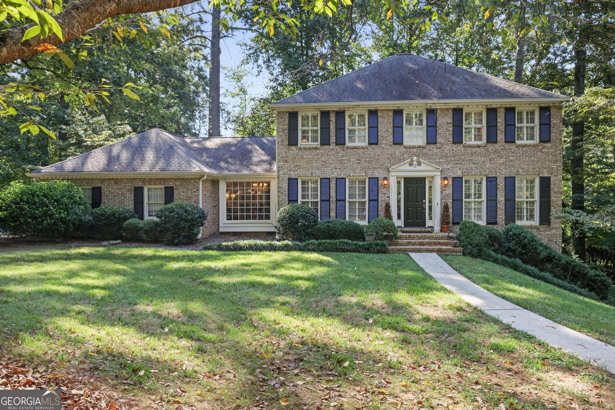 Wonderful and charming traditional four-sided brick home with great curb appeal with a private back yard. This home is located on a cul-de-sac in the highly sought-after North Harbor neighborhood has hardwood floors, crown molding and wood shutters throughout. Upon entering the welcoming foyer, you immediately see the cozy formal living room and a banquet sized dining room. Opposite the living room you will see the guest bedroom, one of four bedrooms. The kitchen and breakfast room open to the huge family room with built-in bookshelves, brick fireplace, and a great view of the backyard. On the main floor is the laundry/mudroom and a keeping room allowing for informal gatherings for family and guests. Upstairs the primary bedroom suite provides a comfortable sanctuary with his and her walk-in closets. There are two additional bedrooms upstairs along with an additional room that can be an office, playroom, or a small guest room. The basement is partially finished and features a fireplace and great space for a playroom, office, or media room. North Harbor offers amenities which include a pool, tennis courts, a picturesque lake and updated clubhouse. North Harbor is not only across the Chattahoochee River from East Cobb, but minutes from City Springs where you can enjoy all the shopping, dining, theatre and arts that there is to offer.