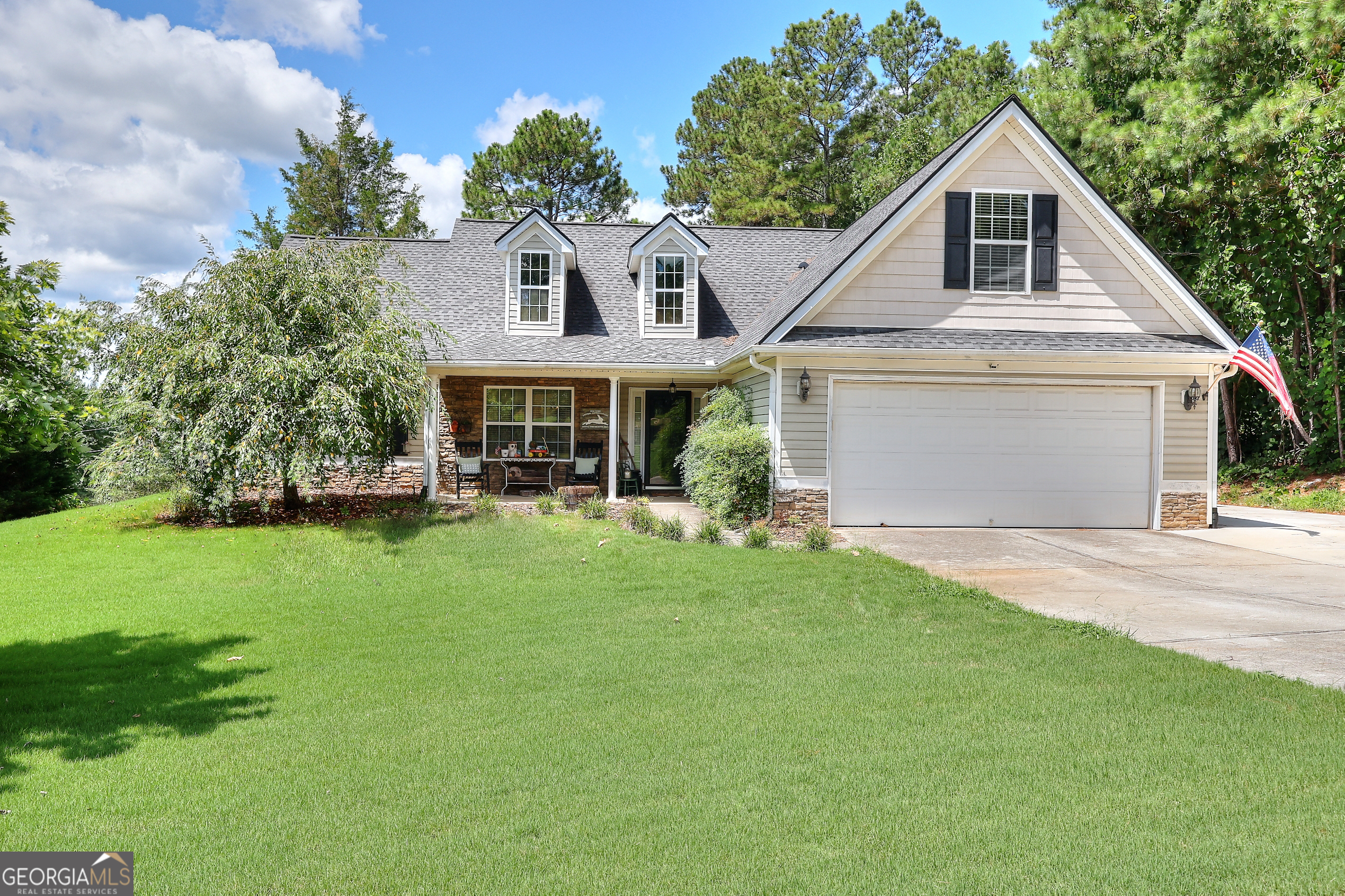 Charming Ranch on Over Half an Acre in Walton County - Bonus Room + Recent Upgrades! Welcome home to a beautifully maintained 3-bedroom, 2-bath ranch with a spacious bonus room, nestled on a quiet street in the sought-after Walnut Grove High School district. This inviting home offers 1,857 square feet of comfortable living space and sits on a generous 0.6-acre lot featuring mature trees and great curb appeal. Step inside to find an open-concept layout with vaulted ceilings and rich hardwood floors in the main living area. The kitchen features brand-new stainless steel appliances, a breakfast nook, and a view to the cozy family room, perfect for everyday living or entertaining. The formal dining room is ideal for hosting special gatherings along with the outdoor patio. The primary suite offers a peaceful retreat with a large soaking tub, separate shower, and double vanity. Two additional bedrooms and a full guest bath are located on the main floor, with a spacious bonus room upstairs that can flex as a 4th bedroom, home office, or media room. This home is move-in ready with a 3-year-old roof, newly installed septic lines, and thoughtful updates throughout. Enjoy peaceful mornings on the rocking chair front porch or host summer BBQs in the large backyard. Located in the desirable Ashley Falls subdivision, just minutes from Walnut Grove, Loganville, and Monroe shopping and dining.