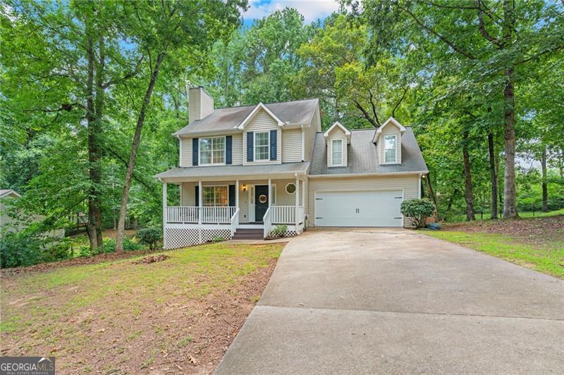 Tucked away in a quiet cul-de-sac right off Hwy 9, this spacious 2-story home offers the perfect blend of peaceful living and prime location. Sitting on nearly half an acre on the Dawsonville/Cumming line, you?ll love the private backyard, usable land, and easy access to GA400, shopping, and dining just minutes away. Step inside to find a bright and open main level with a seamless flow between the living and dining spaces. The kitchen features classic white cabinets, an eat-in breakfast area, and views of your private backyard. Upstairs, you will find the primary suite with a full bathroom, complete with a separate tub, shower, and massive walk-in closet. Three additional bedrooms (including an oversized 4th bedroom) and a full bathroom offer flexibility for guests, home office, or bonus room. Enjoy morning coffee on your welcoming front porch or wind down on the back deck overlooking your yard. Neighborhood perks include a community pool, just in time for finishing out the summer!
