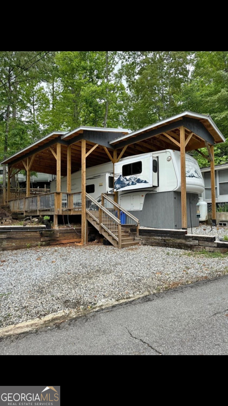 Welcome to your perfect getaway in the beautiful Mountain Lakes Resort, nestled in the scenic hills of White County! This well-maintained one-bedroom, one-bath RV is being sold as is and sits on a picturesque lot near the tranquil waters of Lake Qualatchee-a dream setting for sipping your morning coffee or winding down in the peaceful afternoons. The unit is being sold fully furnished, making it move-in ready for your next adventure, relaxing retreat, or possible short-term rental. Located conveniently near Helen, Cleveland, Blairsville, and Dahlonega, you'll have easy access to some of North Georgia's most charming towns. Mountain Lakes Resort is a gated, family-friendly community offering a host of amenities, including: Indoor and outdoor pools Horseback trail riding Fishing and kayaking on Lake Qualatchee Miniature golf Chapel Country store On-site diner Community room with pool and ping pong tables Playground and more Weekly events include game night, bingo, and karaoke, providing plenty of fun and social opportunities for all ages. This is a rare opportunity to own your own piece of paradise in the North Georgia Mountains. Don't delay-schedule your showing today! Want me to add anything about seasonal outdoor activities or nearby dining options? You said: ADD GATED COMMUNITY ChatGPT said: Sure! The listing already mentions "gated," but I can emphasize it more. Here's the updated version highlighting gated community: Welcome to your perfect getaway in the beautiful Mountain Lakes Resort, nestled in the scenic hills of White County! This well-maintained one-bedroom, one-bath RV is being sold as is and sits on a picturesque lot near the tranquil waters of Lake Qualatchee-a dream setting for sipping your morning coffee or winding down in the peaceful afternoons. The unit is being sold fully furnished, making it move-in ready for your next adventure, relaxing retreat, or possible short-term rental. Located conveniently near Helen, Cleveland, Blairsville, and Dahlonega, you'll have easy access to some of North Georgia's most charming towns. Mountain Lakes Resort is a gated, family-friendly community offering a host of amenities, including: Indoor and outdoor pools Horseback trail riding Fishing and kayaking on Lake Qualatchee Miniature golf Chapel Country store On-site diner Community room with pool and ping pong tables Playground and more Weekly events include game night, bingo, and karaoke, providing plenty of fun and social opportunities for all ages. This is a rare opportunity to own your own piece of paradise in the North Georgia Mountains. Don't delay-schedule your showing today!