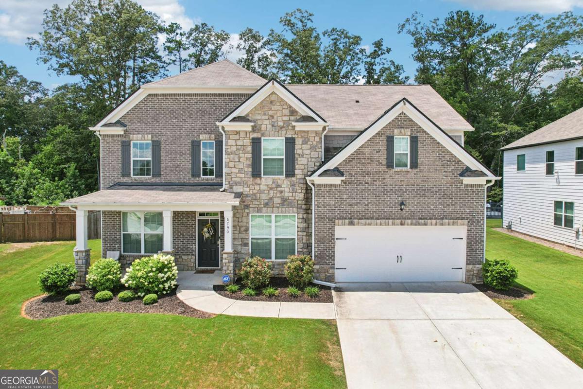 Don't miss this extraordinary opportunity! Discover the epitome of luxury, functionality, comfort, and spacious living in this perfectly crafted beautiful and meticulously maintained 5-bedroom, 3-bathroom, 2-car garage dream home! Built in 2021 by D.R.Horton, this well-sought out Savannah floor plan is a home no one forgets! From the moment you arrive, the professionally landscaped front yard and professionally custom installed exterior uplighting & soffit downlighting enhances the home's stunning craftsmanship and undeniable curb appeal. With one of the largest lots in the neighborhood, you can enjoy the huge fenced-in private back yard, perfect for tranquil mornings, kids at play, weekend football games, or hosting unforgettable holiday gatherings. Step into the elegant 2-story foyer, leading to a formal dining room with coffered ceilings and seating for 8+, a formal living room or flexible home office, a warm & inviting family room with a cozy stack stone fireplace opening to the gourmet kitchen complete with an island perfect for entertaining, 42" upgraded cabinets, a double oven, upgraded countertops, stainless steel appliances, and exquisite LVP flooring! A guest bedroom along with a full bath is conveniently located on the main level. Stepping into the breathtaking owner's retreat will not disappoint, featuring the renowned 'wow-factor' step-up sitting room with a warm and inviting fireplace, an impressive retreat to relax in style. The spa-like ensuite bath offers a tiled 5ft shower, soaking tub, tiled floors, upgraded vanity countertops, and a huge walk-in closet. The upper level also hosts generously sized secondary bedrooms, a spacious laundry room, and all the convenience you expect from a Smart Home. Checking all the boxes for modern living! Located in a swim/tennis/clubhouse community within the desirable Westlake High School district, this home offers easy access to I-20, I-285, Hartsfield-Jackson Airport, and is just 30 minutes from Downtown Atlanta. Close to shopping, dining, entertainment, schools, and the local library. Move-in ready and truly one-of-a-kind-hurry to schedule your showing and make this one your new home today!
