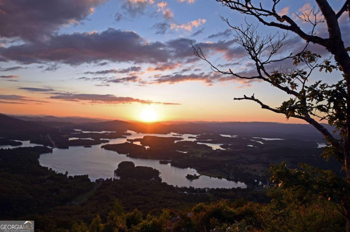 Discover this incredible opportunity to own one of the most recognizable mountains in North Georgia, BELL MOUNTAIN. This Once in a lifetime GORGEOUS property is only minutes from Downtown Hiawassee! The LAYERED MOUNTAIN and PANORAMIC LAKE CHATUGE VIEWS are BREATHTAKING! This 145+/- Acre, unrestricted tract, faces Hiawassee and Lake Chatuge and is the single largest contiguous tract remaining in Towns County. It adjoins Bell Mountain Park at the top and offers multiple sectors of the site with similar views as seen from crest of Bell Mountain. The Property also borders the US Forest Service on two sides creating thousands of acres for your own backyard. Power and Water is available. There is so much potential and so many opportunities for this AMAZING property! Owner financing, with very low interest, can help make this your own scenic, Northeast Georgia mountain. Call me today!