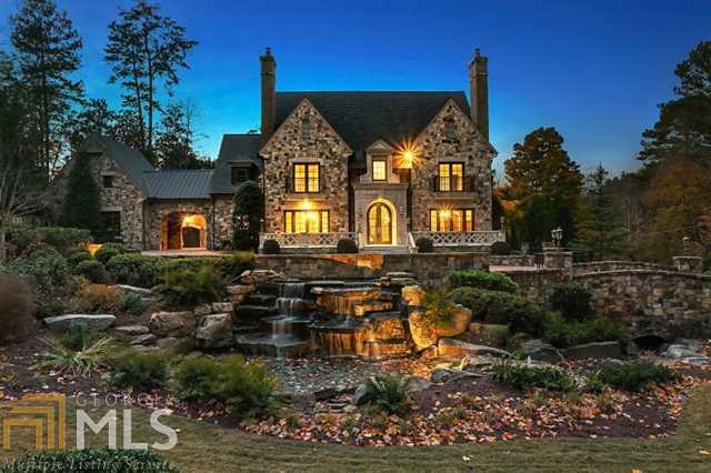 Extraordinary in every way! Fabulous 1M price adjustment, this remarkable Buckhead estate with timeless details and exquisite craftsmanship features gourmet kitchen w/ 2 butlers pantries. Main level master wing. 4 additional ensuite bedrooms upstairs. Lower level has home theater, game room, guest quarters, elegant bar, billiard room & office. Separate carriage house, expansive brick motor court, pool house, outdoor kitchen, saltwater pool/spa. Privacy fencing, children's play yard, double gates, massive signature water feature and extensive landscaping.