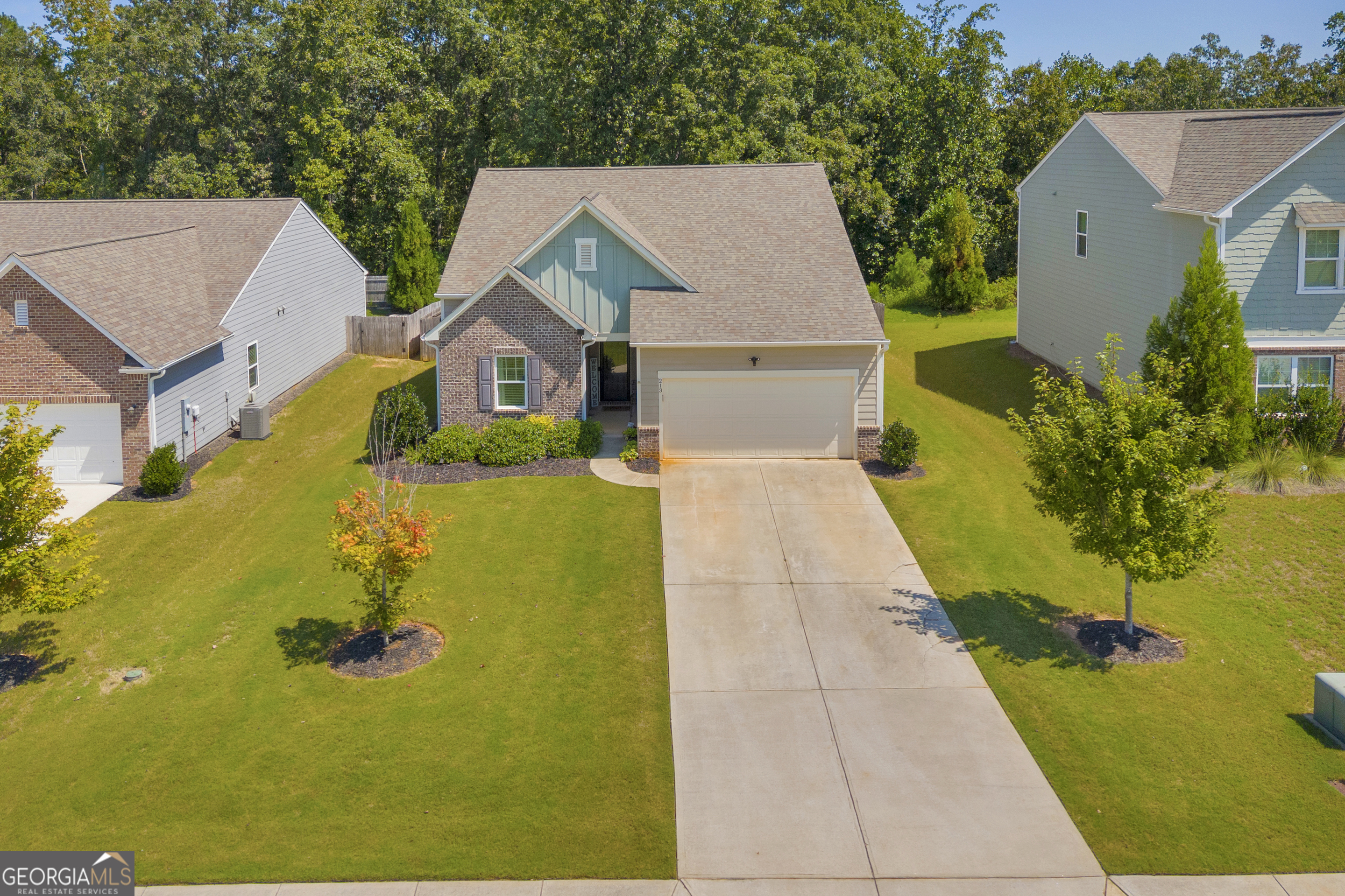 Less than five miles from the heart of Monroe, this ranch style home offers easy main level living. The open concept layout brings people together, with the living room, dining area, and kitchen flowing into one another for a warm and welcoming feel. A shiplap electric fireplace anchors the living room, while the kitchen's oversized island, walk in pantry, and recessed lighting make cooking and gathering effortless. The split bedroom floor plan keeps the private suite tucked away for quiet retreat, with three additional bedrooms ready for family, guests, or a home office. Step outside to a covered deck overlooking the fenced backyard that is perfect for summer cookouts, fall football, or simply unwinding at the end of the day. The neighborhood adds to the lifestyle with a pool, clubhouse, playground, and a walking path. Make this home yours today!