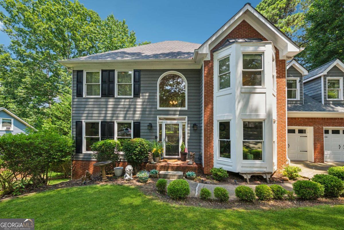 OPEN HOUSE THIS SUNDAY 7/20. 2PM-4PM. ALL BUYERS WELCOME! Nestled within the esteemed Eagle Watch golf community in Woodstock, Georgia, this well maintained 4-bedroom, 2 full bathroom and 2 half bathroom home offers an expansive 3,495 sq ft of living space on a serene fenced lot overlooking the woods. Designed with a spacious layout, hardwood floors, a white cabinet kitchen equipped with stainless steel appliances, tiled backsplash and granite countertops plus a lovely bay window accented breakfast nook overlooking the woods. You will love the large family room with new floors and centered by a gas fireplace and tons of sunlight fill this room and flows into the front living room. The primary suite serves as a private sanctuary, featuring a sitting room area with room for an electric fireplace or an office space. The large en-suite bathroom has an elongated counter with makeup vanity and a large walk-in closet. The main level is bright and cheerful and laid out perfectly. Half bath on main. The upstairs has 2 additional secondary spacious bedrooms one of which is very big and overlooks the front of the home. The terrace level is finished with 2 additional bedrooms and an almost complete full bathroom, which currently is a functioning half bathroom and just needs a shower, floors and drywall. The hard parts have been completed with the plumbing. A large rec room and another deck overlooking the fenced backyard. You also have ample storage space with built in shelving. Low maintenance yard and cul-de-sac street in a highly sought after community with top rated schools. Walk to the pool from your home too. New hot water heater, new garage doors, newer deck, all new light fixtures and door hardware, new floors upstairs. Lots of new, move in ready! Two decks overlooking the back yard. Residents of Eagle Watch enjoy access to a range of amenities, including three sparkling pools, lighted tennis and pickleball courts, a fitness center, playgrounds, and scenic walking trails. The community is also home to the award-winning Canongate Eagle Watch Golf Course with a restaurant on site. Just a short drive away, Downtown Woodstock offers a vibrant mix of dining, shopping, and entertainment. The area hosts year-round events, including a summer concert series and seasonal festivals, creating a lively atmosphere. Outdoor enthusiasts will appreciate the proximity to Lake Allatoona and Red Top Mountain State Park, while the Noonday Creek Trail, a multi-use path, connects the neighborhood to Downtown Woodstock, offering scenic routes for walking and cycling. This home combines luxury living with a strong sense of community, making it an ideal choice.
