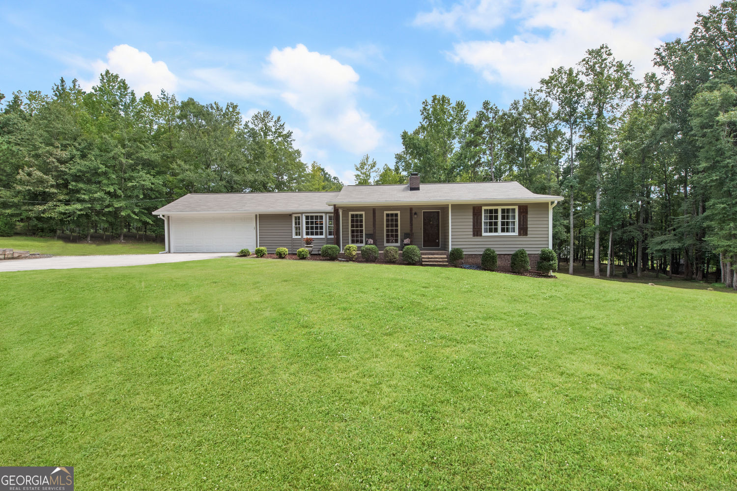 Dream property in the heart of Paulding County! Conveniently located near Hiram shopping, Dallas Hwy, Costco, and more. This private 2.70-acre retreat is exactly what you've been waiting for-open, usable land framed by trees, offering the perfect blend of peace and tranquility. The meticulously maintained ranch-style home features a NEW roof, fresh paint, newer HVAC, and more! Gorgeous, real USA-made Bruce 3/4-inch hardwood floors shine throughout the main living areas. Enjoy a spacious kitchen with updated granite countertops, an island overlooking the breakfast area, and plenty of room for entertaining. Unique character details you won't find in new builds-wood beams, vintage bath tile floors, and wood molding set this home apart. The master suite includes a garden tub, double vanities, and a separate shower for your comfort and convenience. The finished basement offers even more flexibility with space for a potential bedroom, home gym, or office-plus a convenient boat door for easy ATV or equipment storage. No HOA so you can do your own thing! Bring your chickens, gardening or any homesteading plans as this property has endless options! Hurry! This one-of-a-kind home and property won't last!