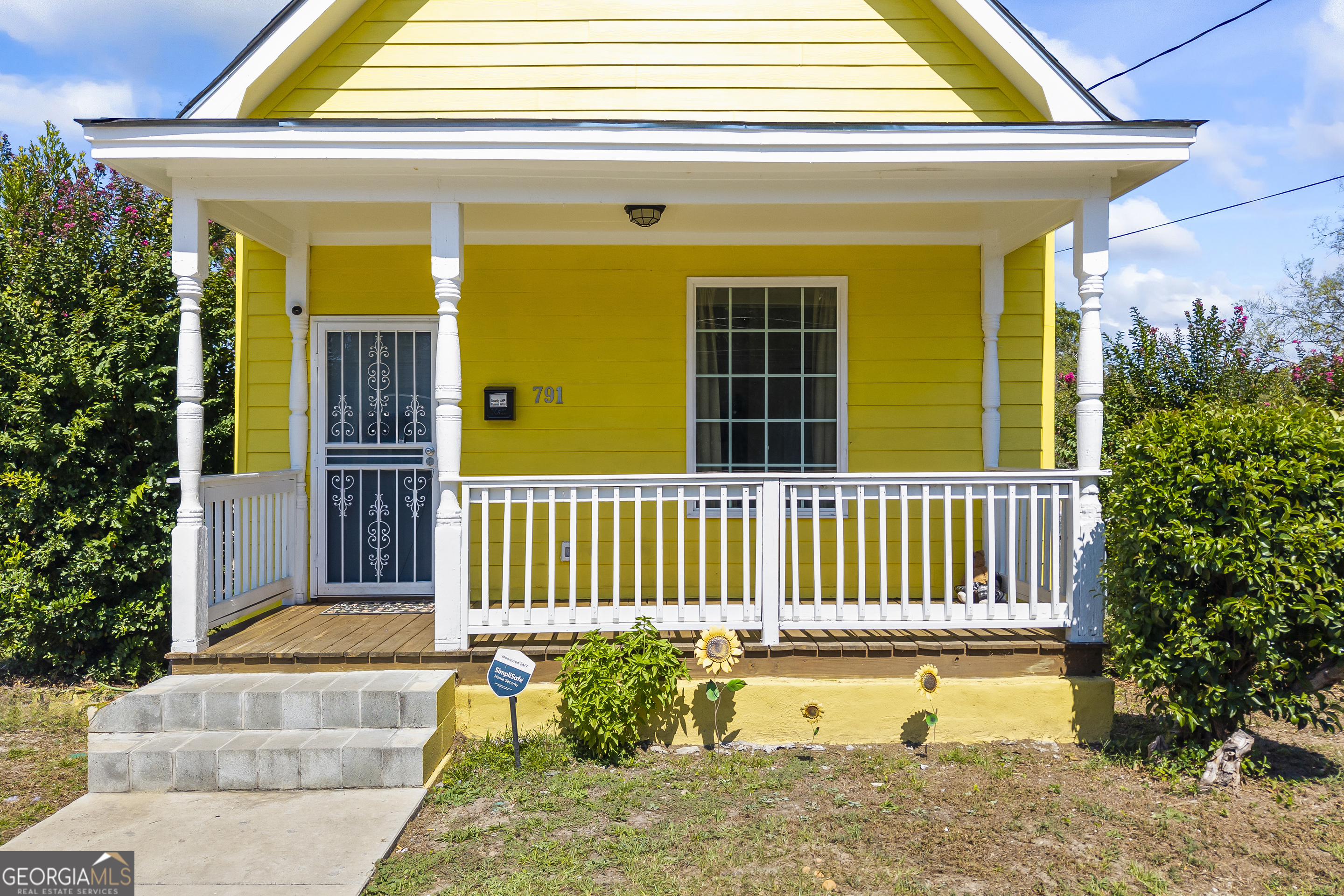 This bright and charming yellow cottage offers 2 bedrooms and 1 bathroom, featuring a cozy front porch and a fully fenced backyard with ample space for gardening, play, or pets. The covered patio, enhanced by a wooden pergola, provides an ideal setting for outdoor relaxation or entertaining!. The kitchen is equipped with stainless steel appliances, adding a modern touch to the home!Additional features include a clean, insulated crawl space that offers extra storage and convenient maintenance access. Don't miss the opportunity to own this charming home close to downtown Macon!