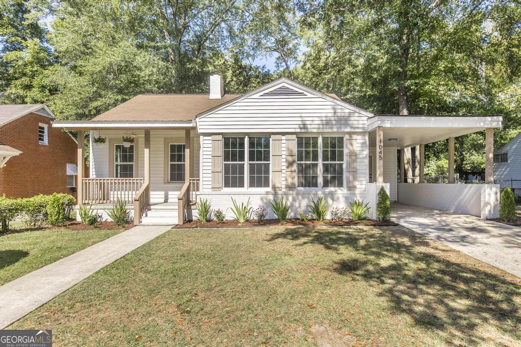 This beautifully remodeled home in the heart of Macon, Georgia, is perfectly located near shopping, downtown, and the interstate, making it both convenient and desirable. The property instantly enhances the neighborhood with fresh landscaping and a welcoming front porch complete with ceiling fans for comfort. Inside, you'll find a grand living room featuring gorgeous wood trim detail that adds warmth and character, along with fresh paint and durable LVP flooring throughout-absolutely no carpet. The kitchen is a showstopper with calming soft-tone colors, a farmhouse sink, stylish backsplash, brand-new appliances, and perfectly chosen fixtures and hardware. The master suite offers a luxurious bathroom with modern finishes, including floor-to-ceiling tile that continues seamlessly from the shower to the vanity, creating a true spa-like retreat. Two additional bedrooms are spacious, and the updated hallway bathroom adds convenience and style. The private backyard provides the perfect setting for outdoor enjoyment, completing this high-quality home that's ready for its next owner.