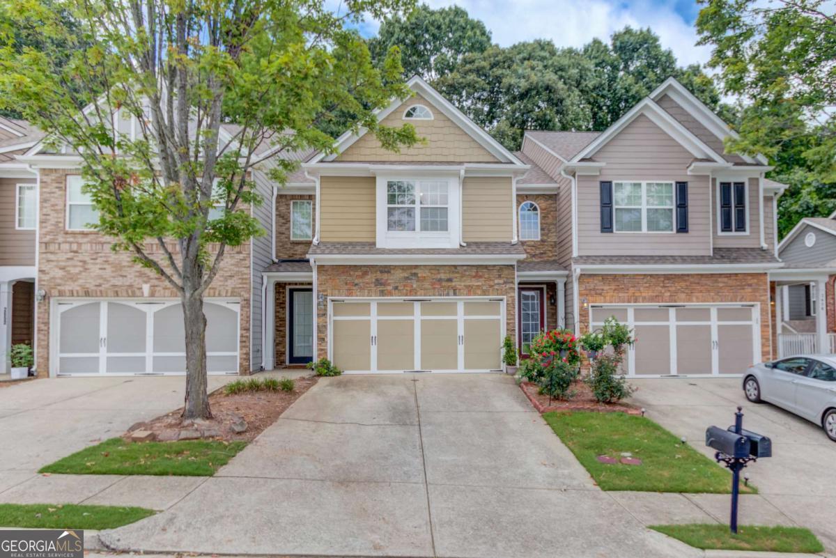 Welcome to 2656 Pierce Brennan Court- this 2 bedroom, 2 and a half bathroom townhome is located in the most convenient location. The oversized primary suite has plenty of room for a reading nook or work space, and features a separate shower and soaking tub- the perfect spot to relax after a long day. The secondary bedroom is also very spacious, and the second bath also features a shower and soaking tub, making this the perfect roommate floor plan. The laundry is located upstairs with the bedrooms, making this chore so much easier. The main level features a bright and airy kitchen and living room, and large island makes cooking a breeze. The HOA takes care of your exterior maintenance and there is no rental cap so whether you're looking for a primary residence or a rental investment, this home is great. Incredible location with easy access to I-85, the Mall of Georgia, Costco, Top Golf, and the list goes on!